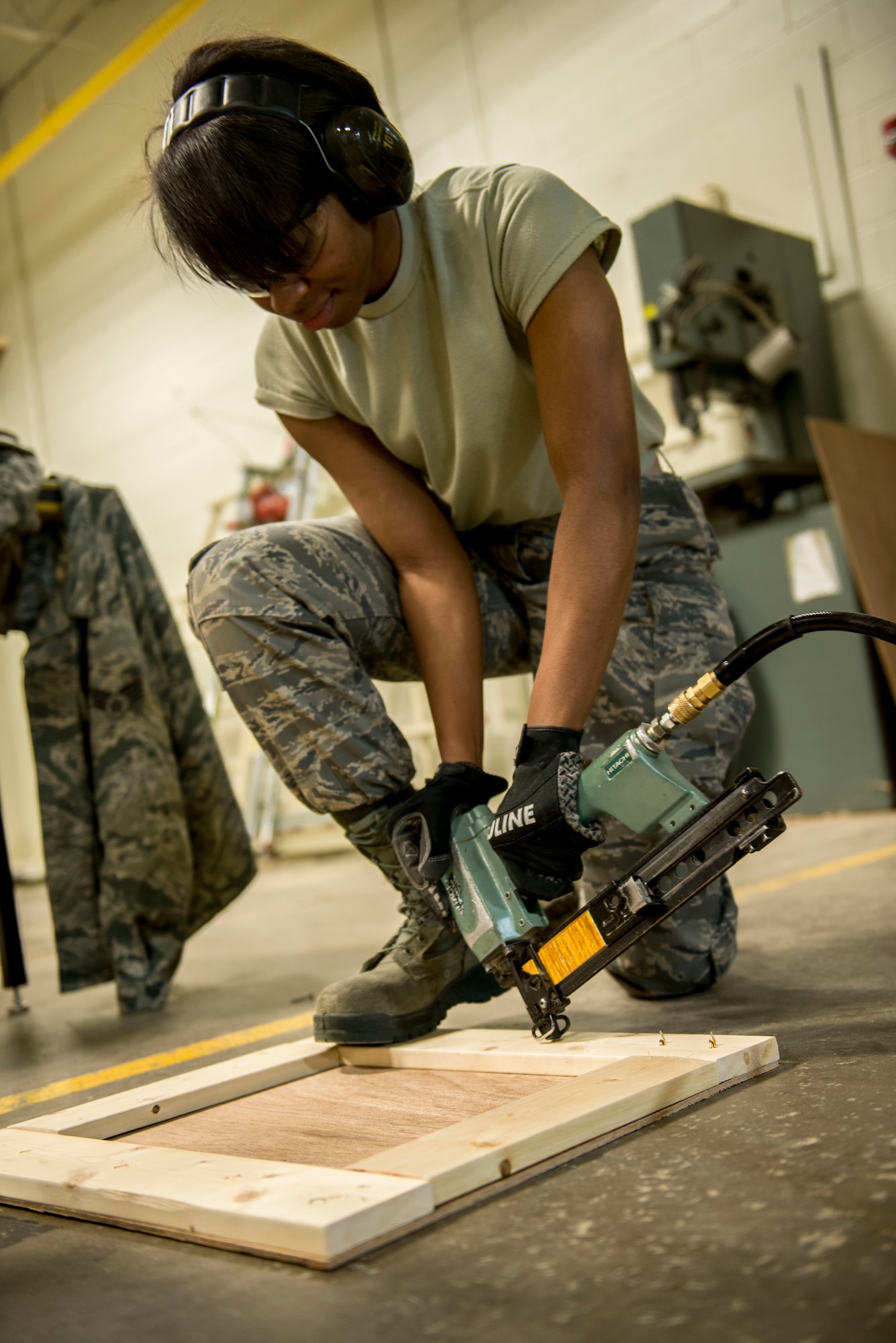 Airman 1st Class Danielle Caldwell, cargo movement specialist from the 5th Logistics Readiness Squadron traffic management office, assembles a crate at Minot Air Force Base, N.D., April 30, 2014. TMO is responsible for packaging and shipping furnished goods to other bases around the world. (U.S. Air Force photo/Airman 1st Class Sahara L. Fales)