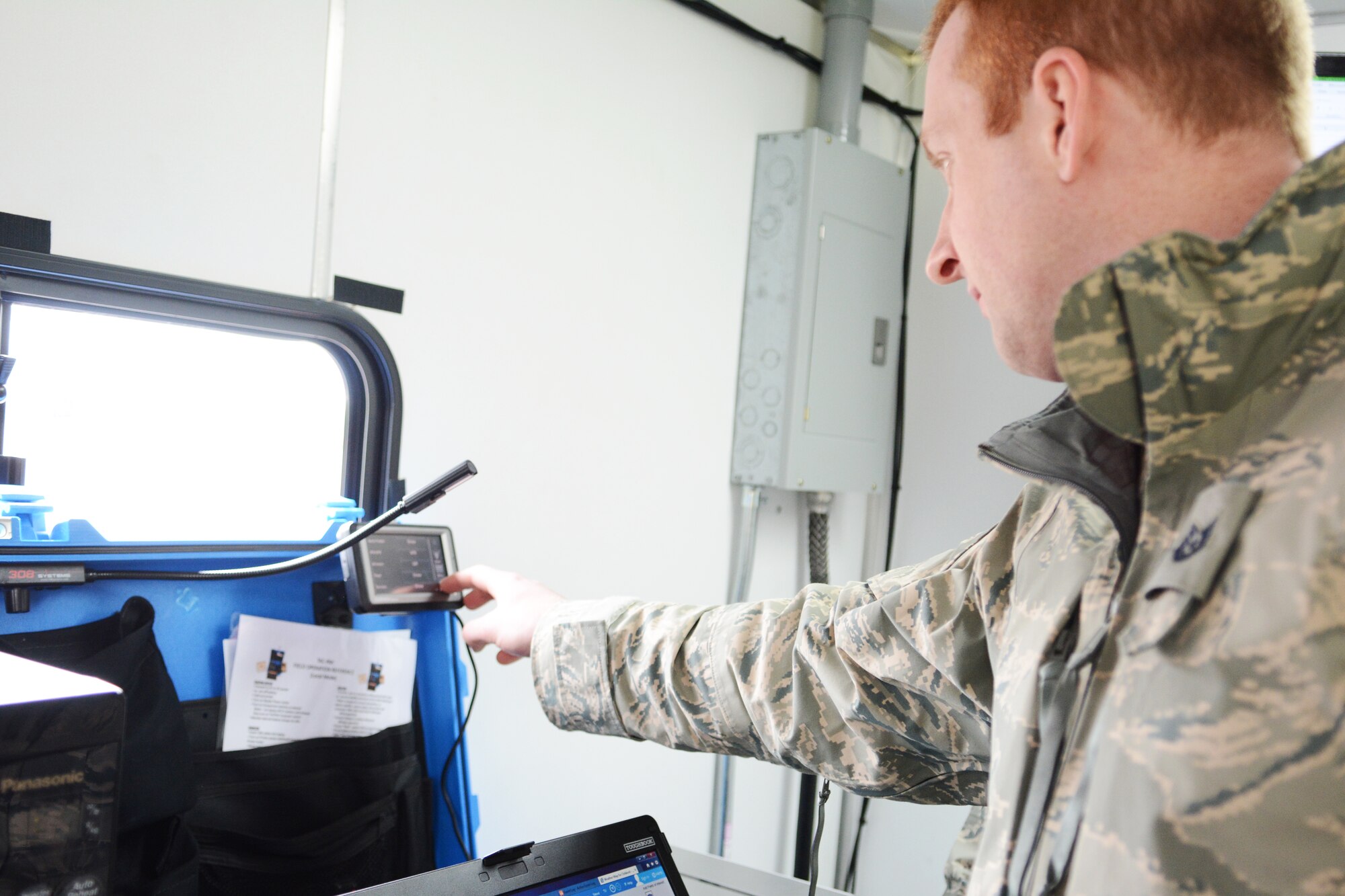 Tech. Sgt. Brian Schmiedlin, 115th Communications Flight, ensures the communication tools are working properly inside the 115th Fighter Wing Mobile Command Post during the 2014 State Interoperable Mobile Communications Exercise in Oshkosh, Wis., May 15, 2014. The 115th FW was one of more than 100 agencies from 34 communication platforms that attended. (Air National Guard photo by Senior Airman Andrea F. Liechti)