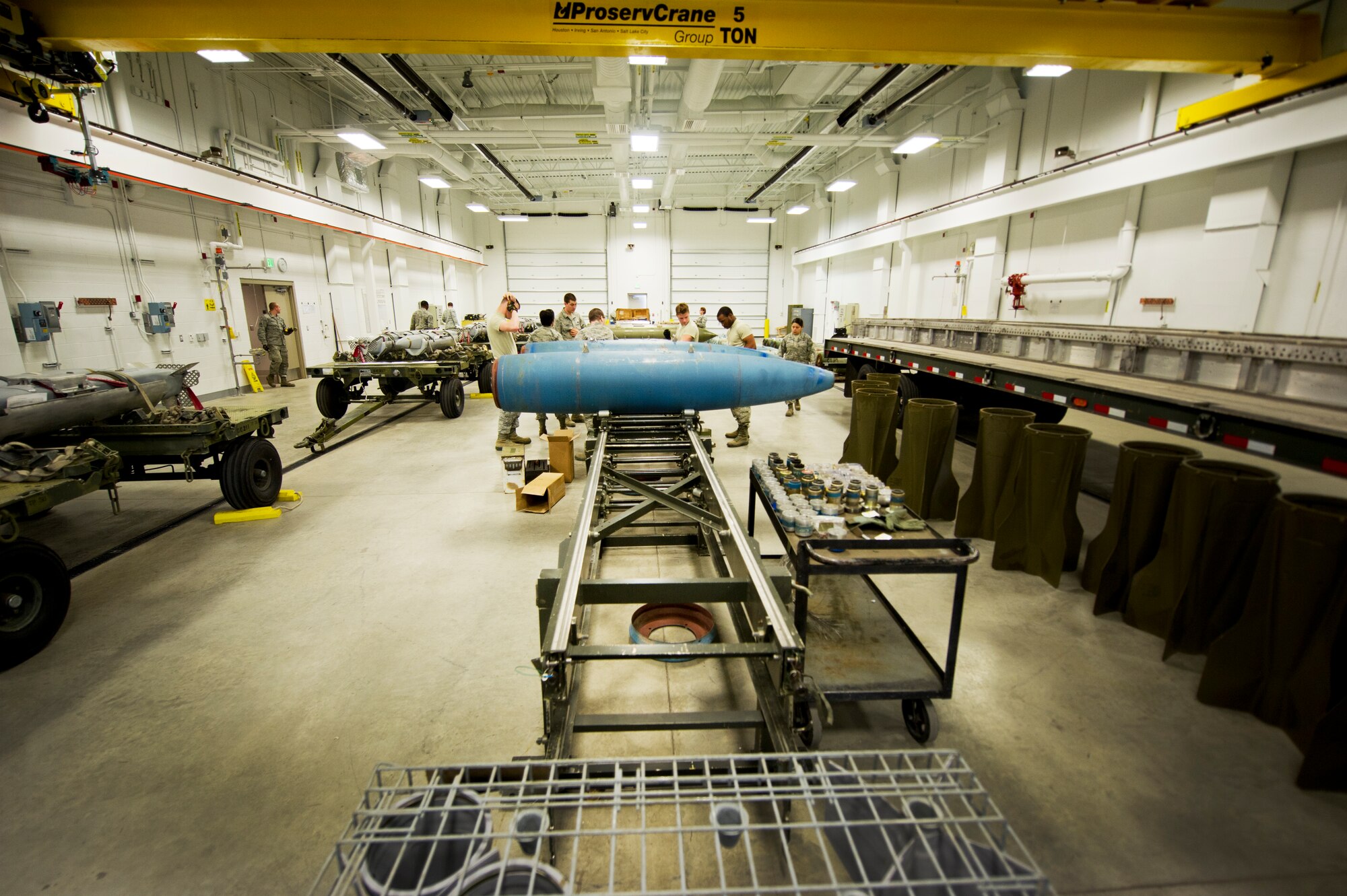 Airmen from the 5th Munitions Squadron assemble weapons during Tundra Thunder at Minot Air Force Base, N.D., May 12, 2014. The entire squadron, which is approximately 122 ammo personnel, participated in this event and built roughly 830 conventional munitions and 324 ALA-17 flare countermeasures. (U.S. Air Force photo/Senior Airman Brittany Y. Auld)
