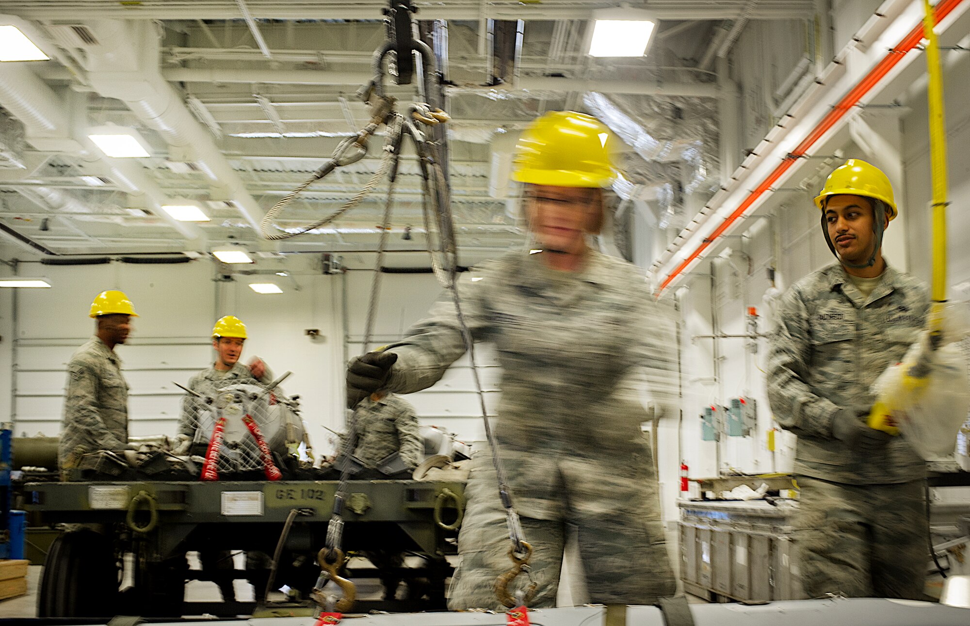 Airman 1st Class Alyssa Shuffler, 5th Munitions Squadron munitions journeyman, moves a weapon into a crate during Tundra Thunder at Minot Air Force Base, N.D., May 12, 2014. Tundra Thunder is a five-day internal 5th Munitions Squadron training exercise designed to evaluate and validate the 5th MUNS warfighting capabilities in support of conventional operations.  (U.S. Air Force photo/Senior Airman Brittany Y. Auld)