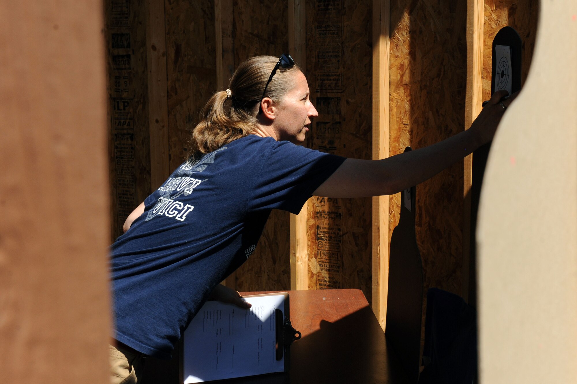 Staff Sgt. Rachel Schaap, 4th Security Forces Squadron defender, grades a target during a tactics competition, May 14, 2014, at Seymour Johnson Air Force Base, North Carolina. During National Police Week, members of both Ft. Bragg’s Special Reaction Team and the Wayne County Sherriff’s Department joined the 4th SFS to participate in a timed competition, which consisted of multiple obstacles and techniques. (U.S. Air Force photo/Airman 1st Class Aaron J. Jenne)