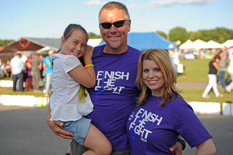 Maj. Amber Millerchip, 4th Fighter Wing public affairs chief, and her family members, participated in an American Cancer Society Relay for Life event, May 16, 2014, in Goldsboro, North Carolina. Both Millerchip and her husband are cancer survivors. The American Cancer Society is a private organization and has no governmental status.   (U.S. Air Force photo/Airman 1st Class Aaron J. Jenne)