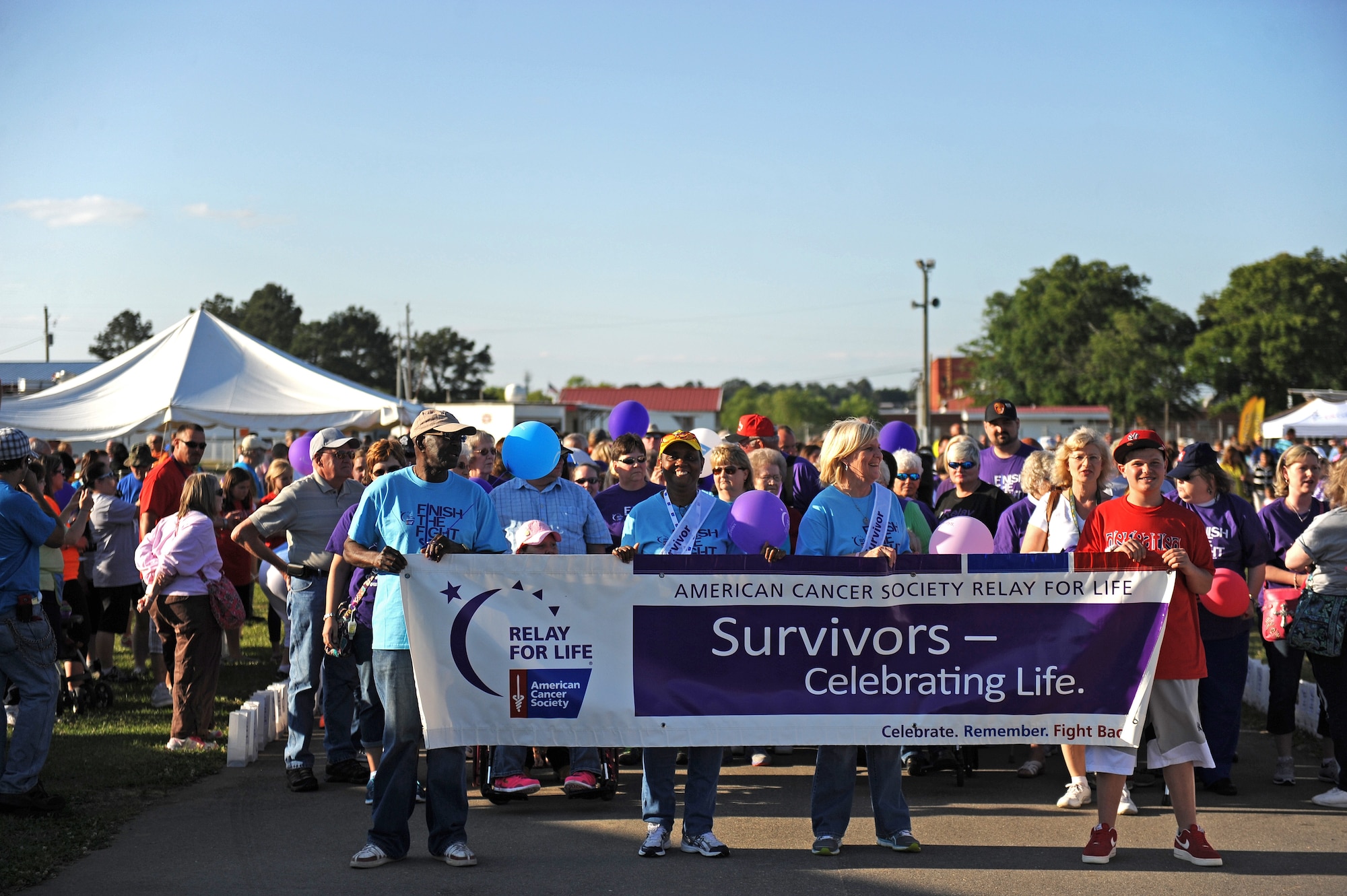Airmen from Seymour Johnson Air Force Base participate in an American Cancer Society Relay for Life event, May 16, 2014, in Goldsboro, North Carolina. Airmen and Service members joined teams to show their support to finding a cure for cancer. The American Cancer Society is a private organization and has no governmental status. (U.S. Air Force photo/Airman 1st Class Aaron J. Jenne)