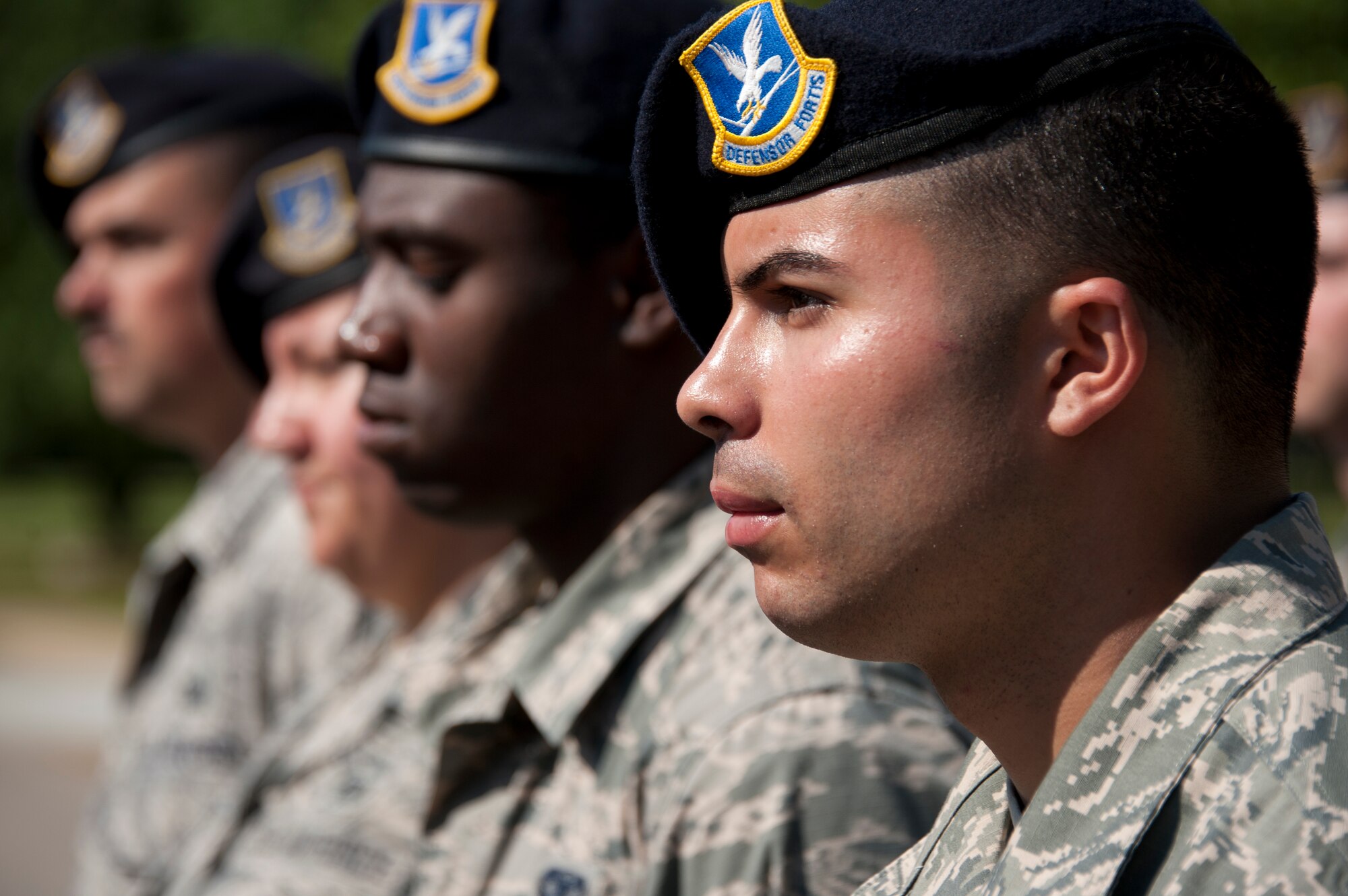 Staff Sgt. Eddie Sang, 42nd Security Forces Squadron, stands in formation during a National Police Week retreat ceremony here, May, 16, 2014. The ceremony included speeches from retired and active duty security forces members as well as a 21-gun salute. The squadron held events on base all week to pay tribute to law enforcement members who made the ultimate sacrifce in the line of duty.(U.S. Air Force photo by Staff Sgt. Natasha Stannard.)