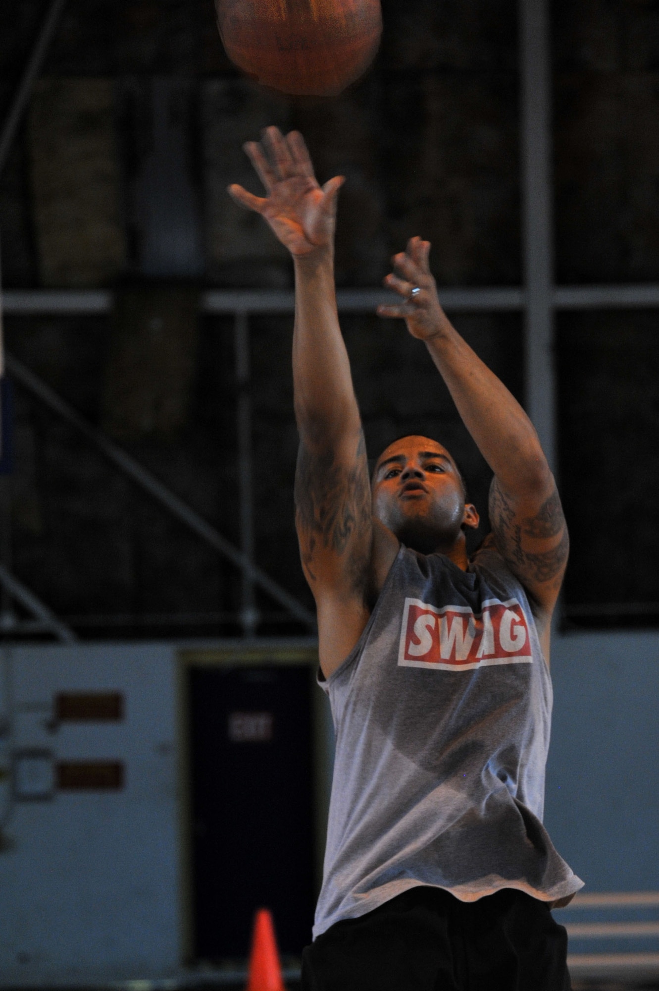 Giovanni Rios-Vega, SFS 2 team member, shoots from the three-point line during a National Police Week three-on-three basketball tournament at Maxwell Air Force Base, May 13, 2014. The tournament featured three 42nd Security Forces Squadron teams, and recognized SFS members for their sacrifice. Police week was established by a joint resolution of Congress in 1962 to pay special recognition to law enforcement officers who lost their lives in the line of duty. (U.S. Air Force photo by Staff Sgt. Natasha Stannard)