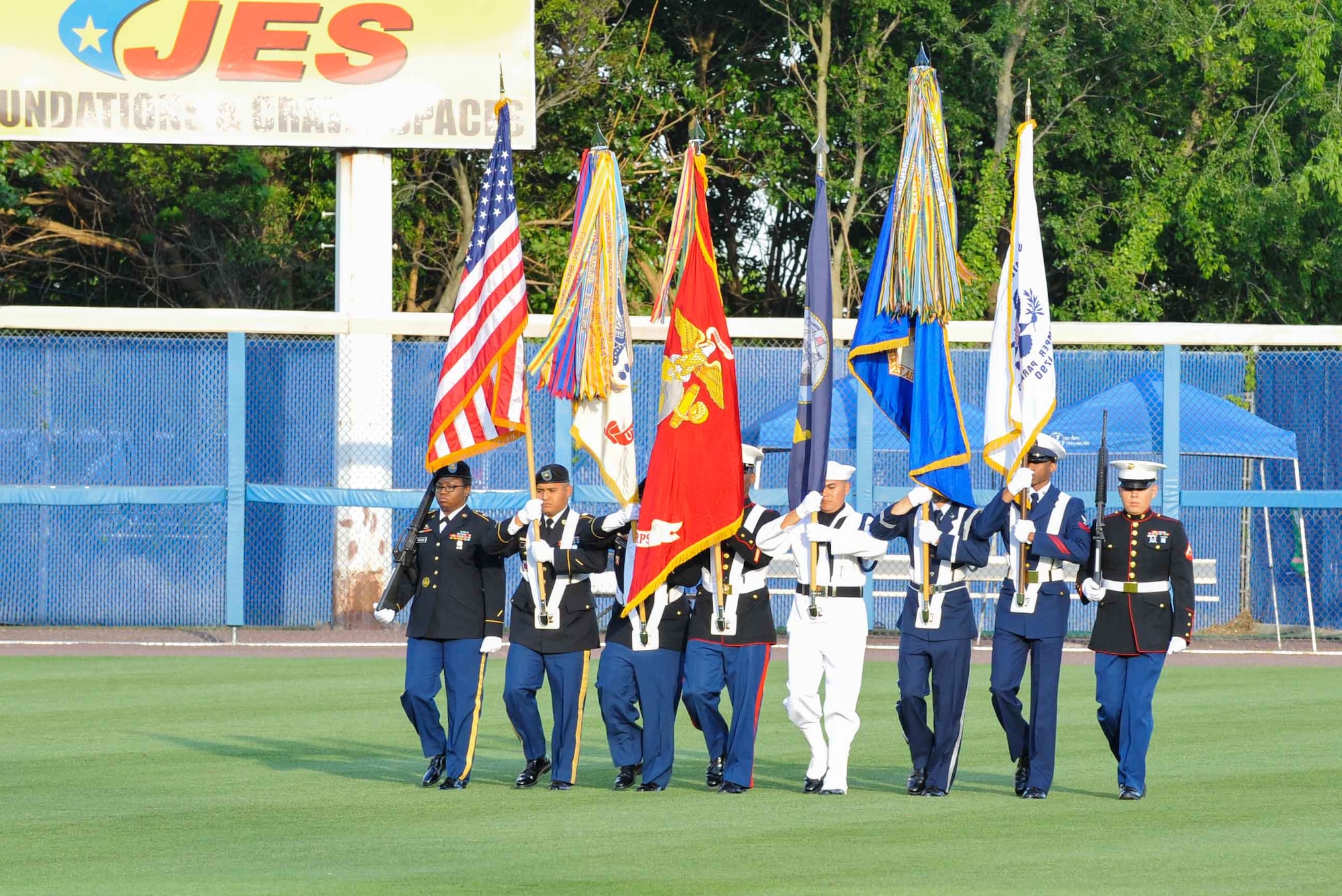 The U.S. Joint Service Color Guard presents the colors during the opening ceremony of the Norfolk Tides’ 19th Annual Armed Forces Night at Harbor Park Stadium in Norfolk, Va., May 17, 2014. Events included performances of U.S. military anthems, a fireworks display as well as first pitches thrown by Service members from each branch of the Armed Forces. (U.S. Air Force photo by Staff Sgt. Wesley Farnsworth/Released)