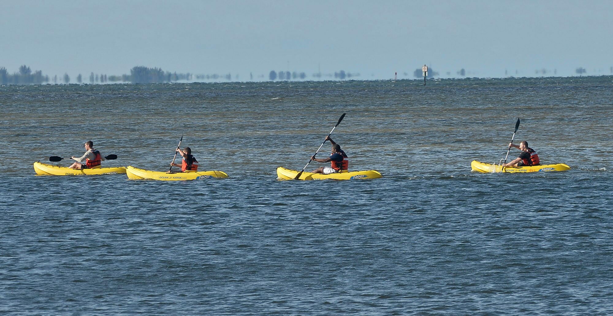 Members from the 6th Security Forces Squadron participate in a kayak race during a defenders challenge, May 16, 2014 at MacDill Air Force Base, Fla. The challenge was one of many events held in celebration of National Police Week. (U.S. Air Force phot by Senior Airman Jenay Randolph/Released)