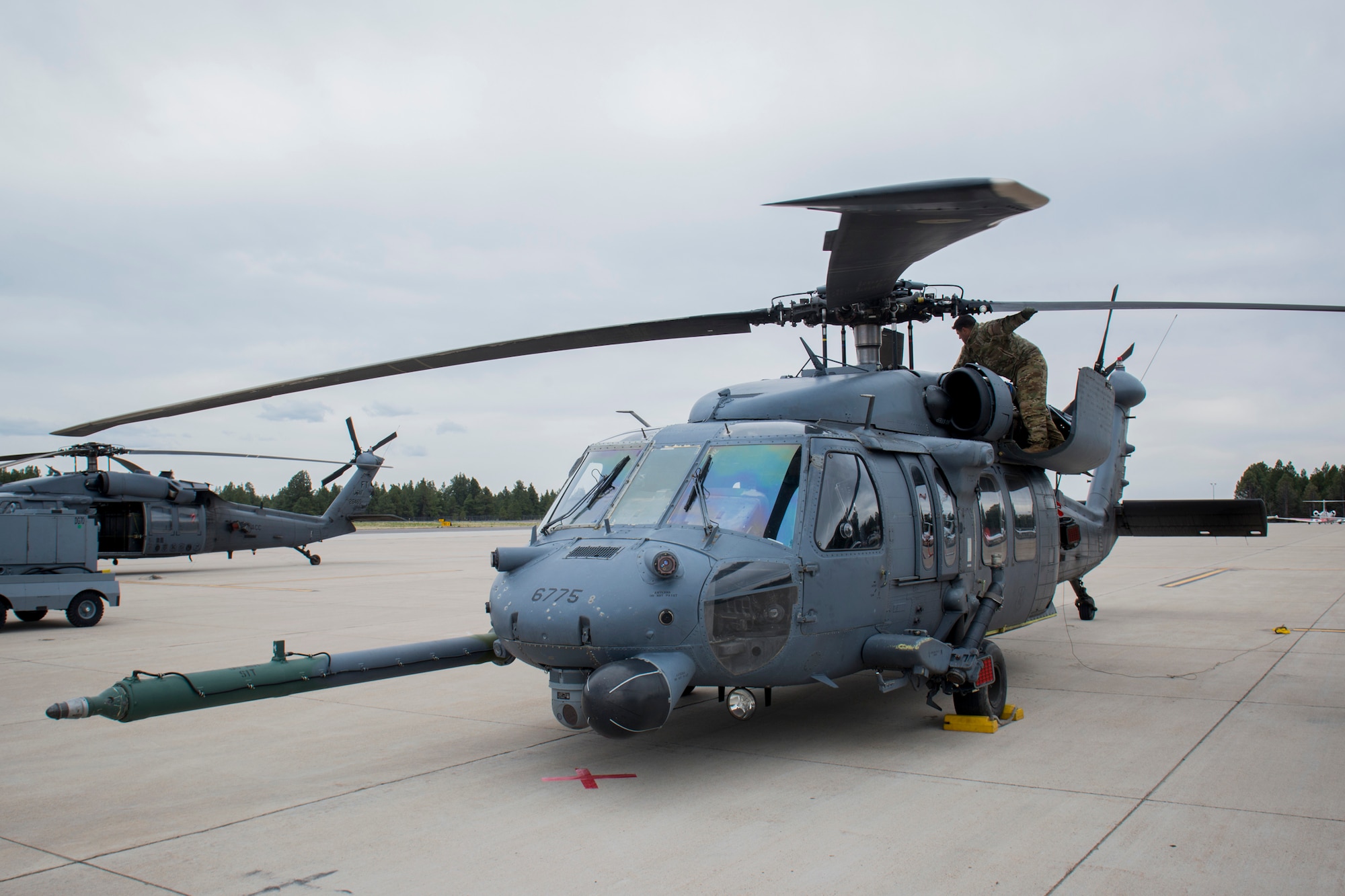 U.S. Air Force Tech. Sgt. Vincent Hnat, 41st Rescue Squadron special missions aviator out of Moody Air Force Base, Ga., inspects the rotor blades of an HH-60G Pave Hawk May 6, 2014, at Flagstaff Pulliam Airport, Ariz. Hnat and his air crew operated the HH-60 during Angel Thunder, an exercise that provides personnel recovery and combat search and rescue training for combat air crews, pararescue, intelligence personnel, battle managers and joint search and rescue center personnel. (U.S. Air Force photo by Staff Sgt. Jamal D. Sutter/Released) 