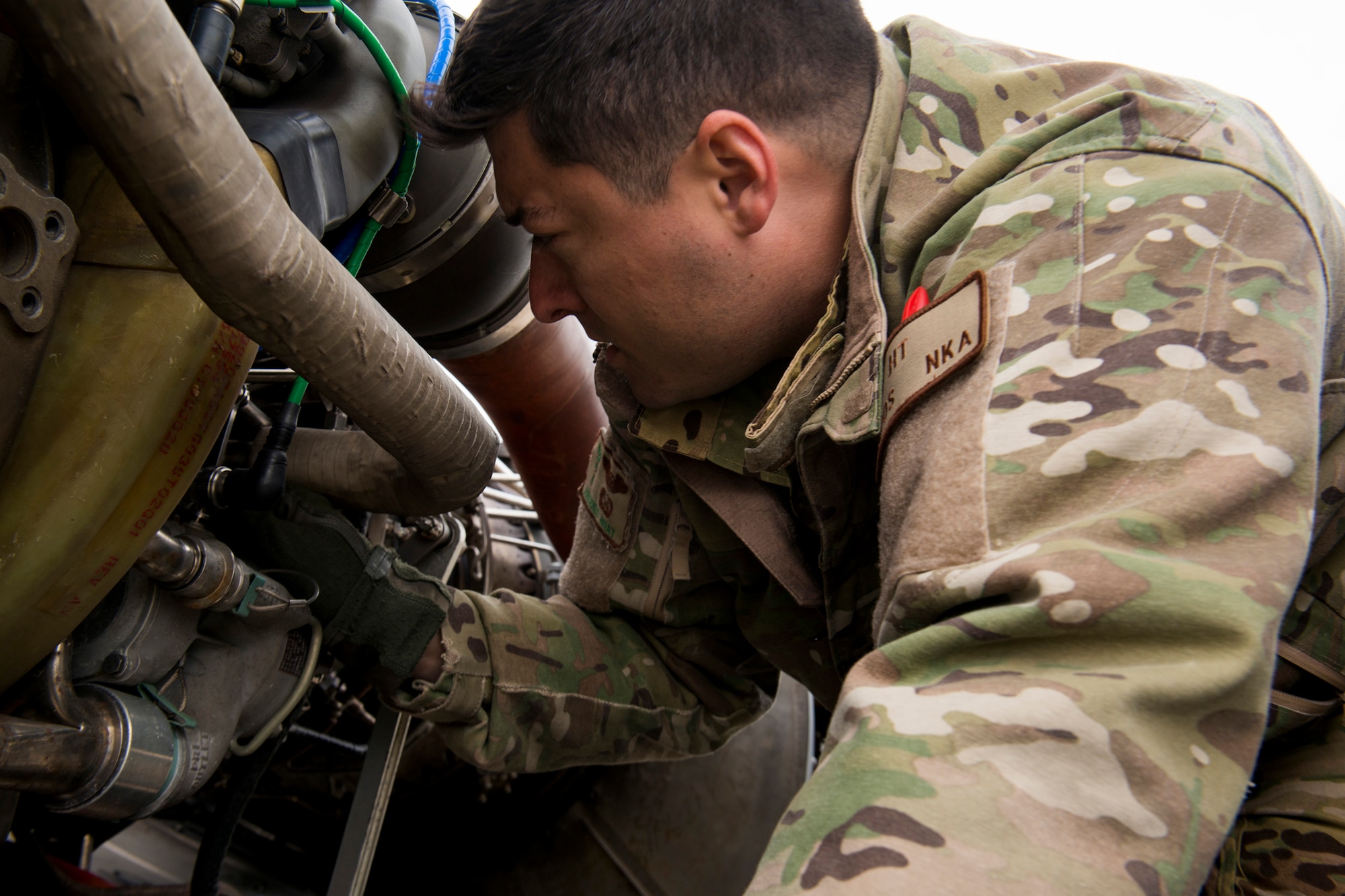 U.S. Air Force Tech. Sgt. Vincent Hnat, 41st Rescue Squadron special missions aviator out of Moody Air Force Base, Ga., inspects an HH-60G Pave Hawk May 6, 2014, at Flagstaff Pulliam Airport, Ariz. Before arriving to Moody in 2013, Hnat was assigned to the 55th RQS at Davis-Monthan Air Force Base, Ariz., for four years. (U.S. Air Force photo by Staff Sgt. Jamal D. Sutter/Released)  