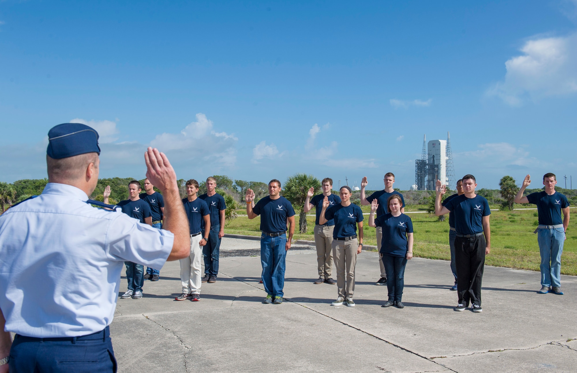 Thirteen U.S. Air Force recruits raise their right hand during a Delayed Entrance Program swear-in ceremony at Cape Canaveral Air Force Station, Fla., Complex 34, May 14, 2014. The Delayed Entrance Program is a program for recruits who have decided to enlist in the Air Force but have not been sent to basic training yet. (U.S. Air Force photo/Matthew Jurgens)