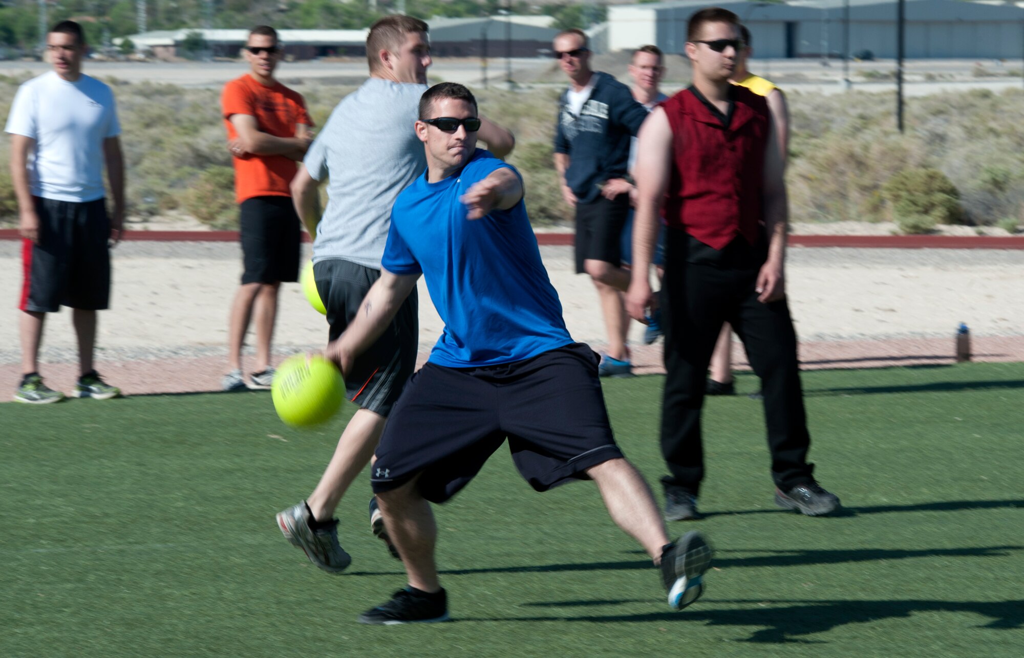 Staff Sgt. Andrew, 432nd Maintenance Squadron ammunition accountability manager, zeroes in on a target during a dodge ball event May 12, 2014, as part of Police Week at Creech Air Force Base, Nev. National Police Week started in 1962 to pay special recognition to those law enforcement officers who have lost their lives in the line of duty (Last names have been withheld for security reasons). (U.S. Air Force photo by Tech. Sgt. S.E./Released)