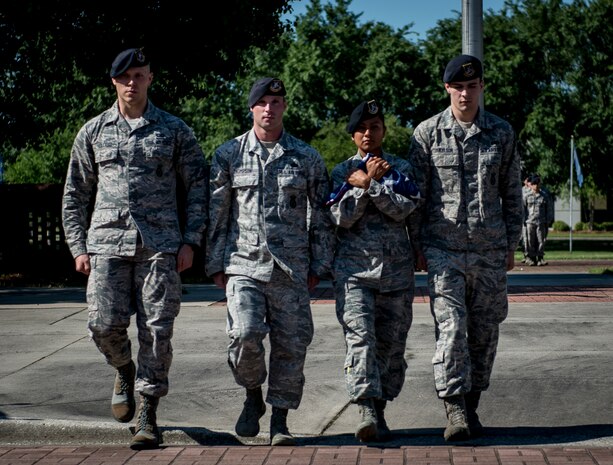 Members of the 628th Security Forces retire the colors during the Police Week Retreat ceremony May 16, 2014, at Joint Base Charleston – Air Base, S.C. The 628th SFS held different events and activities to commemorate National Police Week from May 11 to 17. (U.S. Air Force photo/ Senior Airman Dennis Sloan)