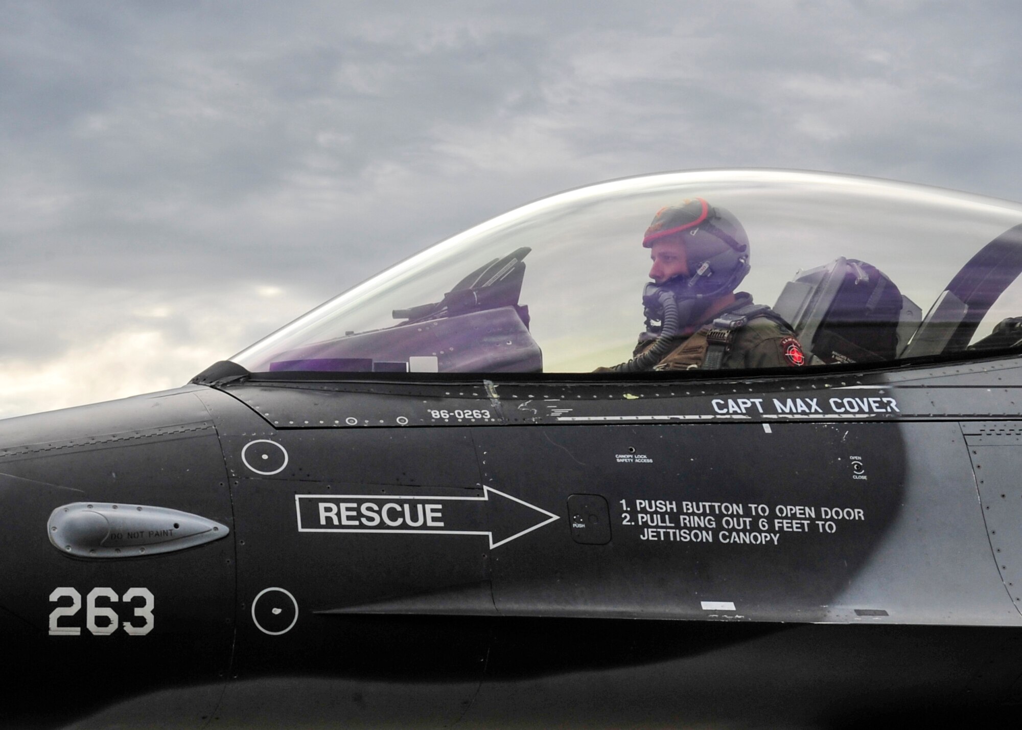U.S. Air Force Capt. Howard Turner, 18th Aggressor Squadron pilot, prepares for flight in an F-16 Fighting Falcon, May 16, 2014, Eielson Air Force Base, Alaska. The 18th AGRS have flown more than 70 flights during the first week of RED FLAG-Alaska 14-1. (U.S. Air Force photo by Senior Airman Ashley Nicole Taylor/Released)