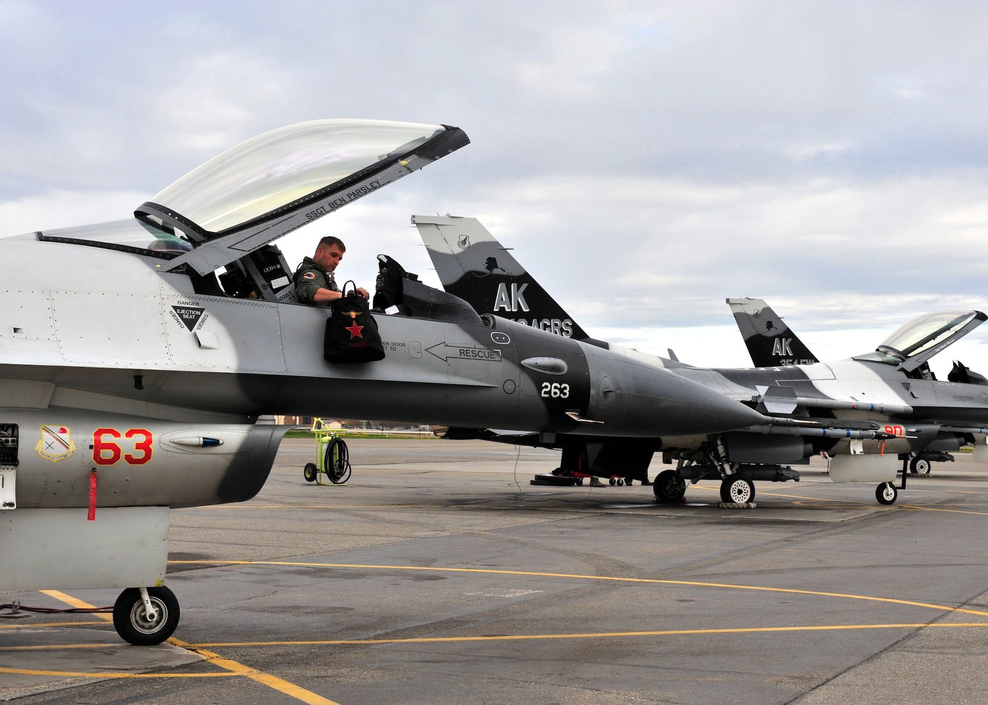 U.S. Air Force Capt. Howard Turner, 18th Aggressor Squadron pilot, enters an F-16 Fighting Falcon, May 16, 2014, Eielson Air Force Base, Alaska. The 18th AGRS have flown more than 70 flights during the first week of RED FLAG-Alaska 14-1. (U.S. Air Force photo by Senior Airman Ashley Nicole Taylor/Released)