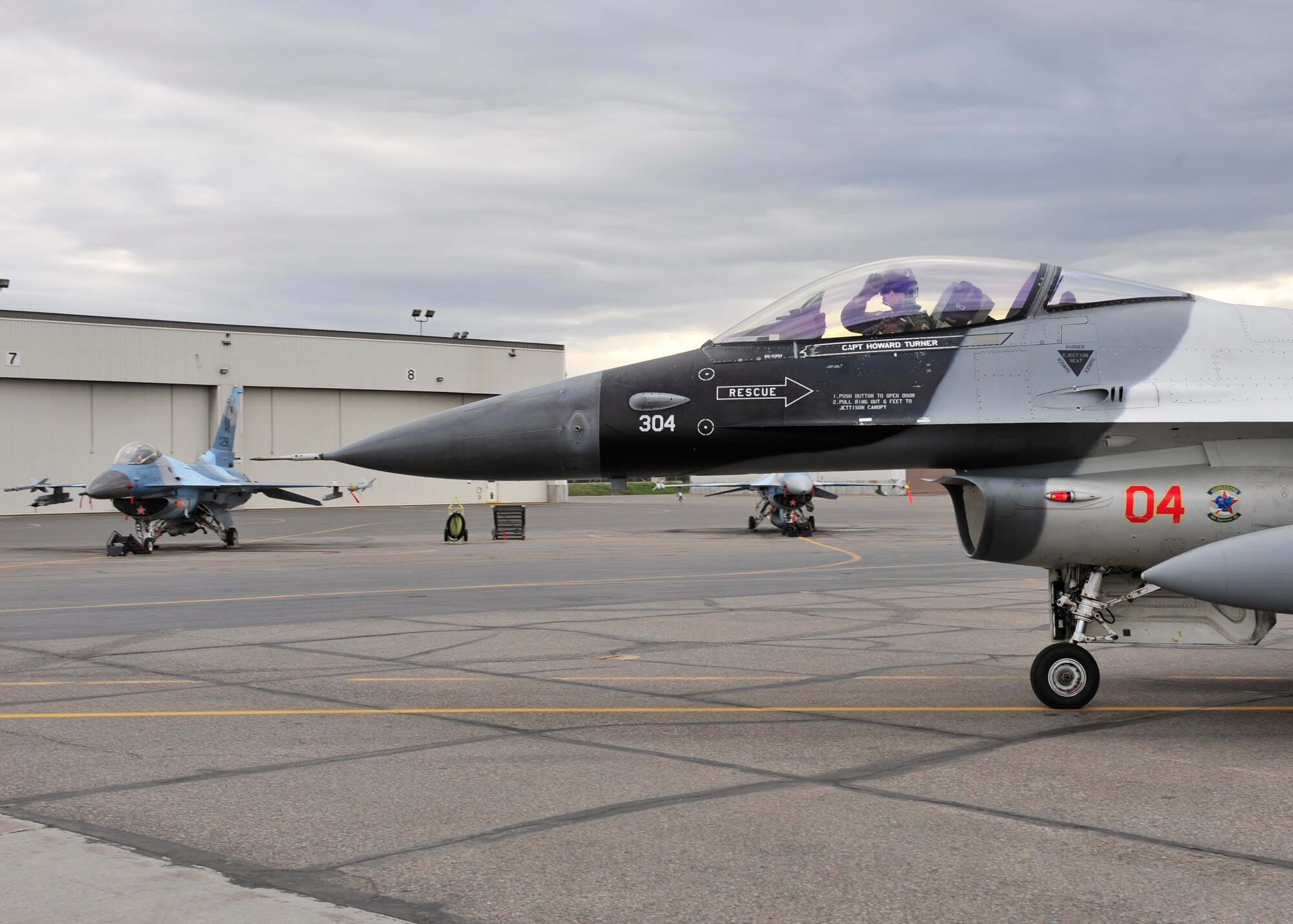 U.S. Air Force Brig. Gen. Mark Kelly, 354th Fighter Wing commander, waves before taking off May 16, 2014, Eielson Air Force Base, Alaska. Kelly, along with 18th Aggressor Squadron pilots, flew in support of RED FLAG-Alaska 14-1. (U.S. Air Force photo by Senior Airman Ashley Nicole Taylor/Released)