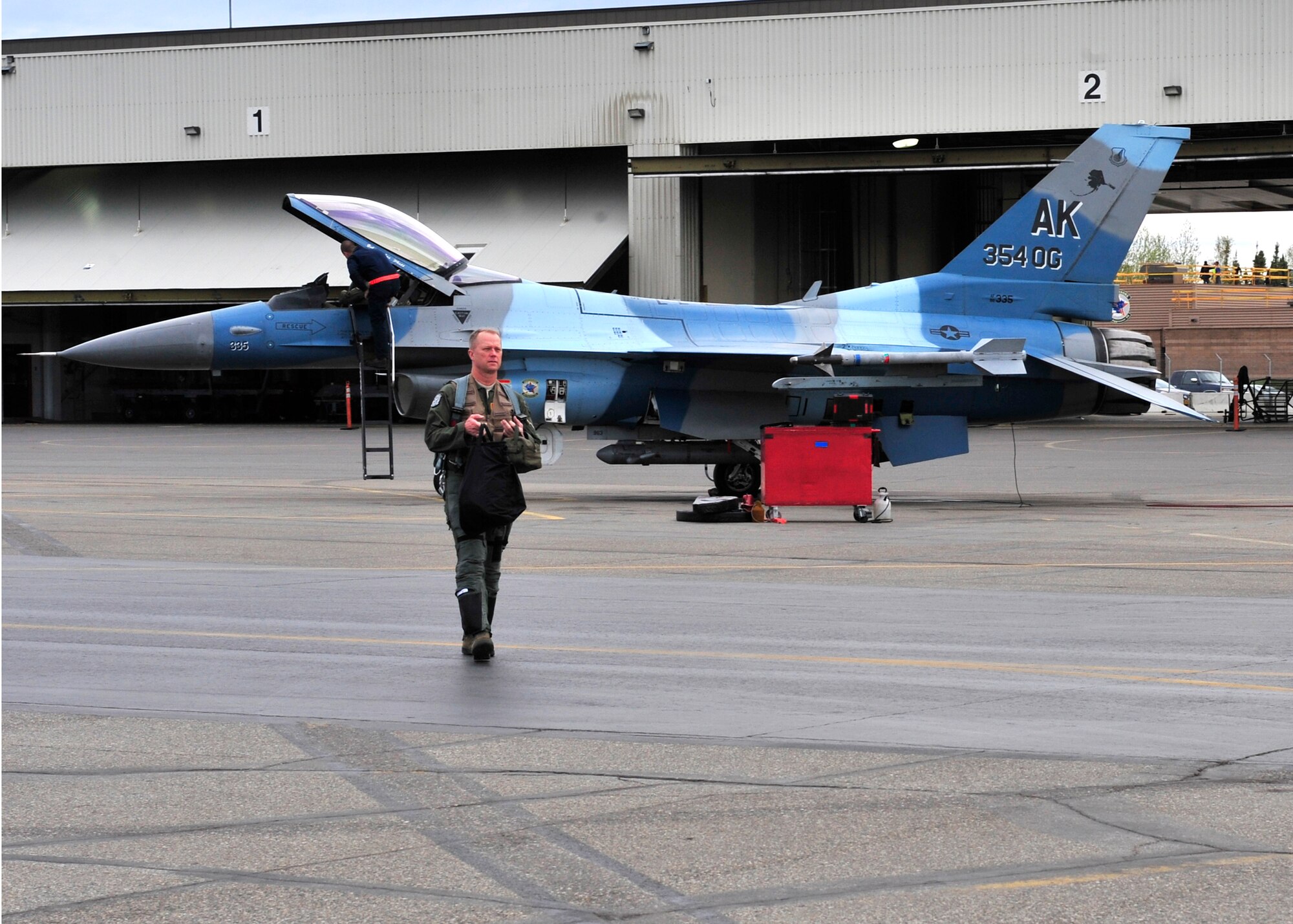 U.S. Air Force Brig. Gen. Mark Kelly, 354th Fighter Wing commander, prepares for flight in an F-16 Fighting Falcon May 16, 2014, Eielson Air Force Base, Alaska. Kelly, along with 18th Aggressor Squadron pilots, flew in support of RED FLAG-Alaska 14-1. (U.S. Air Force photo by Senior Airman Ashley Nicole Taylor/Released) 