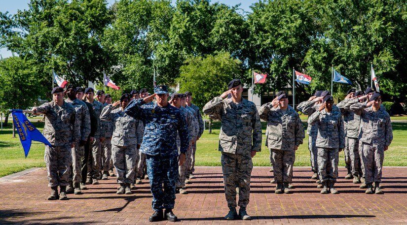 Members of the 628th Security Forces Squadron salute the flag during a retreat ceremony May 16, 2014, on Joint Base Charleston, S.C. The 628th SFS held different events and activities to commemorate National Police Week from May 11 to 17. (U.S. Air Force photo/Airman 1st Class Clayton Cupit)