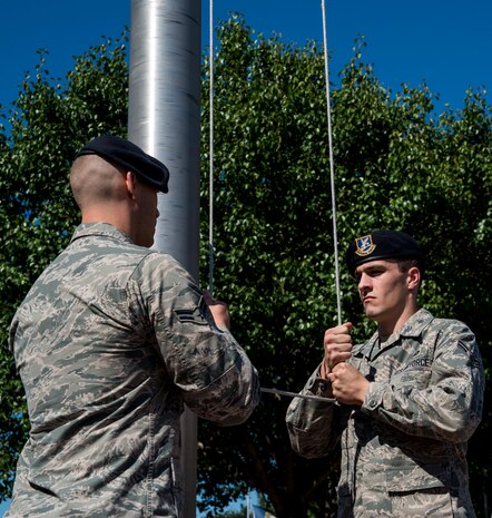 Members of the 628th Security Forces Squadron participate in a retreat ceremony May 16, 2014, on Joint Base Charleston, S.C. The 628th SFS held different events and activities to commemorate National Police Week from May 11 to 17. (U.S. Air Force photo/ Airman 1st Class Clayton Cupit) 