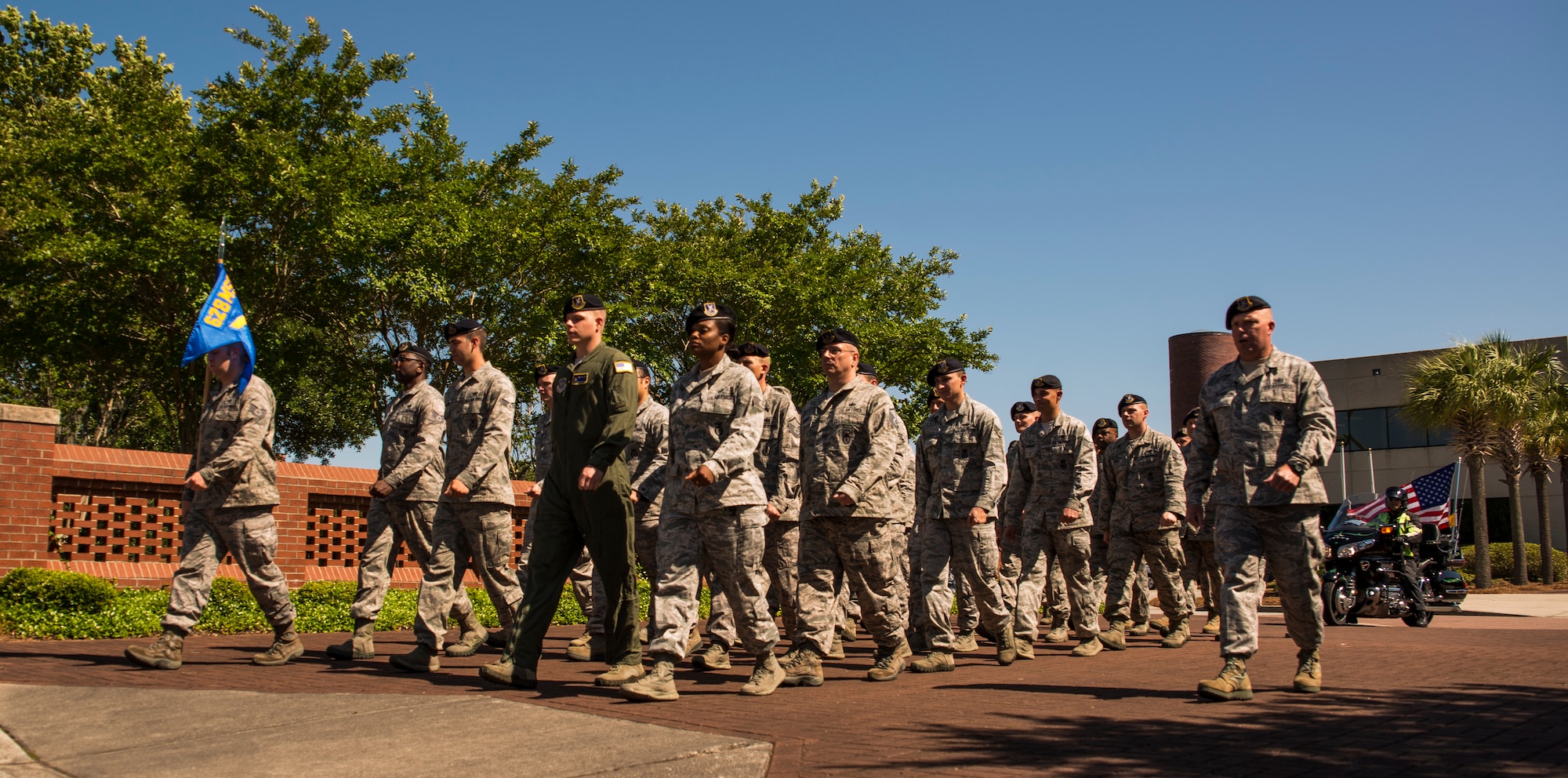 Members of the 628th Security Forces Squadron march towards the flagpole for a retreat ceremony May 16, 2014, on Joint Base Charleston, S.C. The 628th SFS was accompanied by members of the Patriot Guard Riders, a non-profit organization which ensures dignity and respect at memorial services honoring fallen military heroes, first responders and honorably discharged veterans. (U.S. Air Force photo/ Airman 1st Class Clayton Cupit)