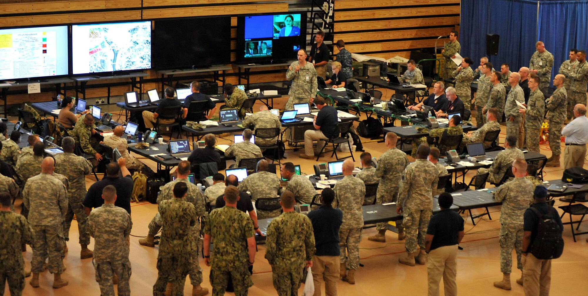 U.S. Army Maj. Paul Sechler, briefs manager, Joint Task Force Civil Support, conducts a shift change brief during Sudden Response 2014 at Camp Dawson, W.Va,  May 13, 2014. Shift change briefs are structured to cover the current situation and any changes to the plan or commanders intent. JTF-CS anticipates, plans and prepares for chemical, biological, radiological and nuclear defense support to civil authorities response operations. (DOD photo by U.S. Navy Petty Officer 1st Class Brian Dietrick/Released)