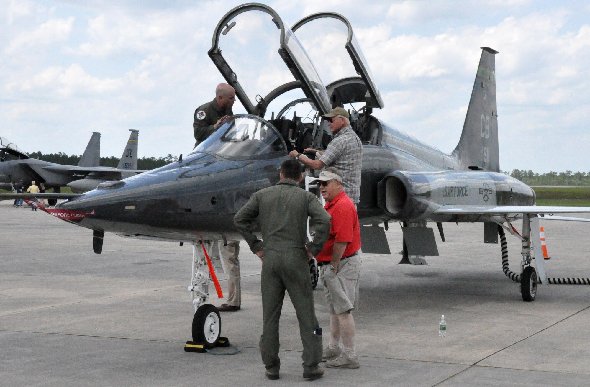 Military and civilian participants view aircraft during the Military and Civilian Aviation Safety Day at Stennis International Airport May 16 2014. Military and civilian aviators from the area flew in to Stennis for a day of briefings and professional networking.