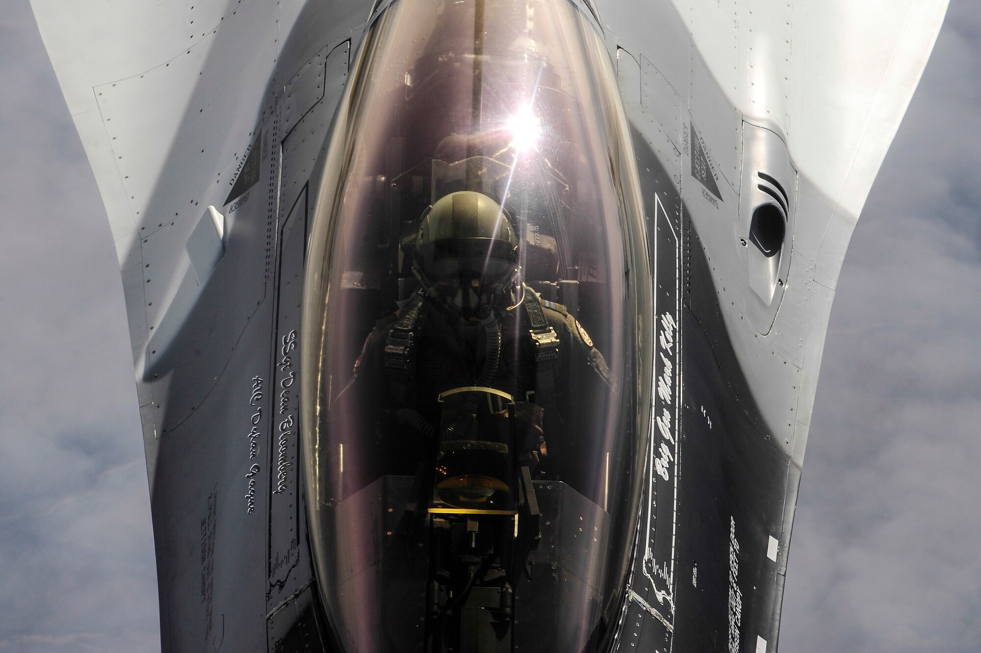 A U.S. Air Force F-16 Fighting Falcon pilot from the 18th Aggressor Squadron, Eielson Air Force Base, Alaska, approaches a KC-135 Stratotanker to be refueled over the Joint Pacific Alaska Range Complex during RED FLAG-Alaska 14-1 May 15, 2014. During RF-A, the 18th AGRS trains allied and coalition forces with real-world combat scenarios by mimicking adversarial flying techniques. (U.S. Air Force photo by Senior Airman Zachary Perras/Released)