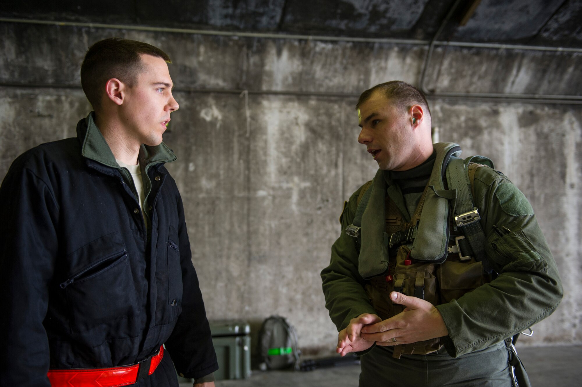 KEFLAVIK, Iceland – 1st Lt. Tyler Studeman, 48th Air Expeditionary F-15C Eagle pilot, speaks with Senior Airman Andrew Kiel, 48th AEG crew chief, after preparing an aircraft for short-notice takeoffs at Keflavik International Airport May 15, 2014. The men are deployed for Icelandic Air Policing, which is part of NATO’s commitment to keep Iceland’s airspace safe and secure. (U.S. Air Force photo/Tech. Sgt. Benjamin Wilson)(Released)