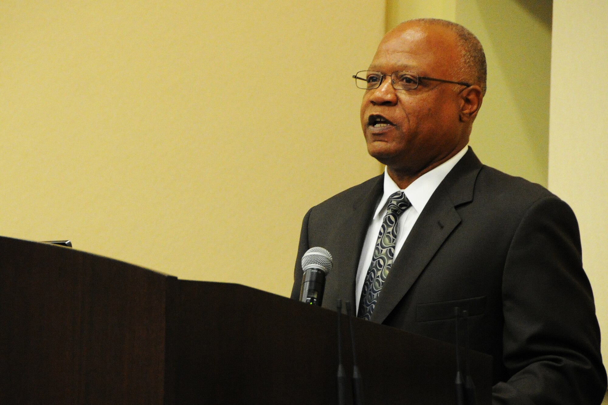 Mr. Ron Malone, Air Force District of Washington A4/7 Transportation and fuels branch chief, provides opening remarks for the 2014 Logistics Readiness Forum on Joint Base Andrews, Md., May 13, 2014. The forum invited National Captial Region logistics career field leaders to discuss joint service programs and total force development. (U.S. Air Force photo/Staff Sgt. Matt Davis)