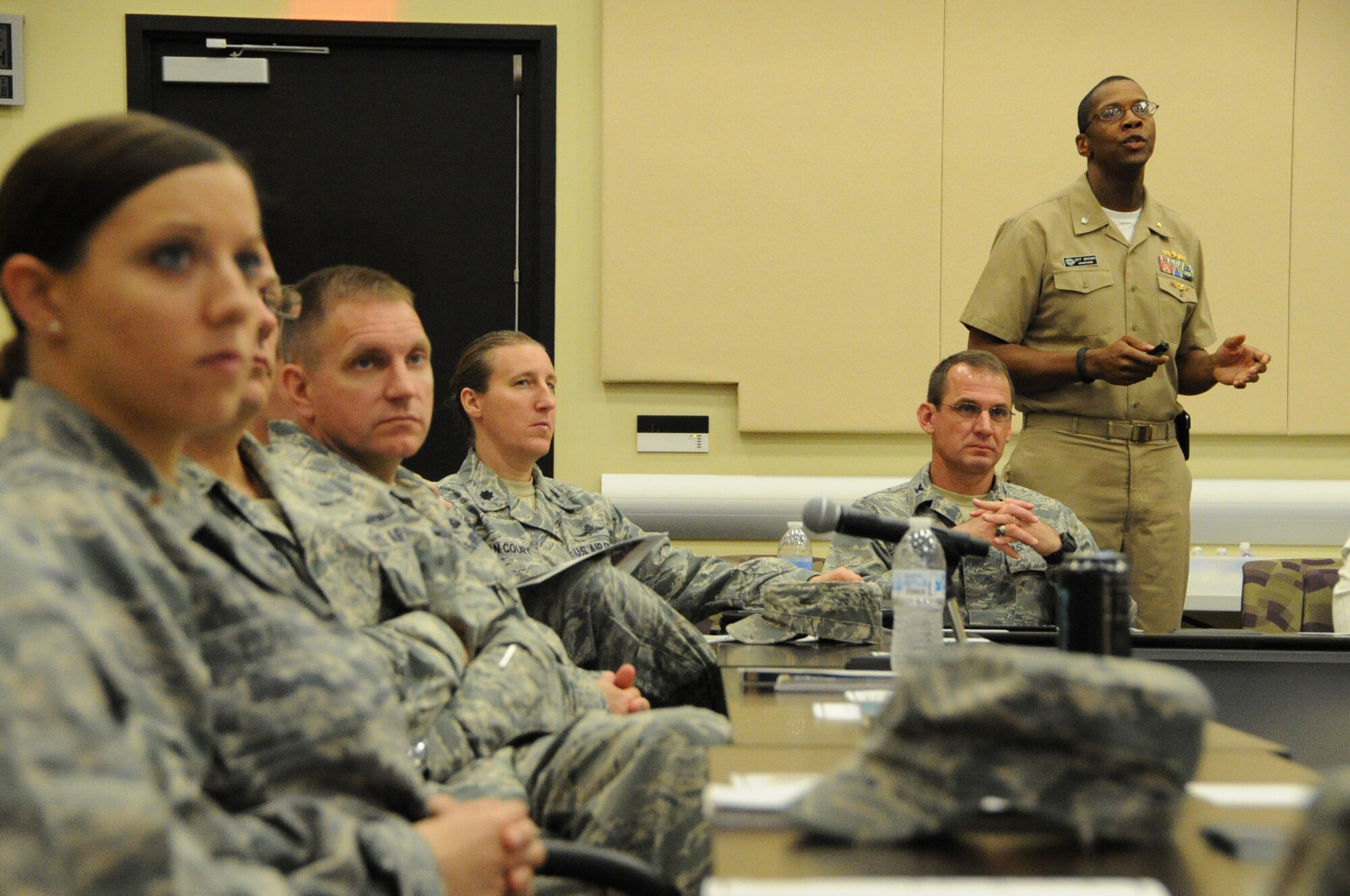 U.S. Navy Cmdr. Jeffery Brown, Joint Force Headquarters National Capital Region and Military District of Washington Plans and Operations/J4 chief, briefs attendees on the joint services mission during the 2014 Logistics Readiness Forum on Joint Base Andrews, Md., May 13, 2014. The forum invited National Capital Region logistics career field leaders to discuss joint service programs and total force development. (U.S. Air Force photo/Staff Sgt. Matt Davis)