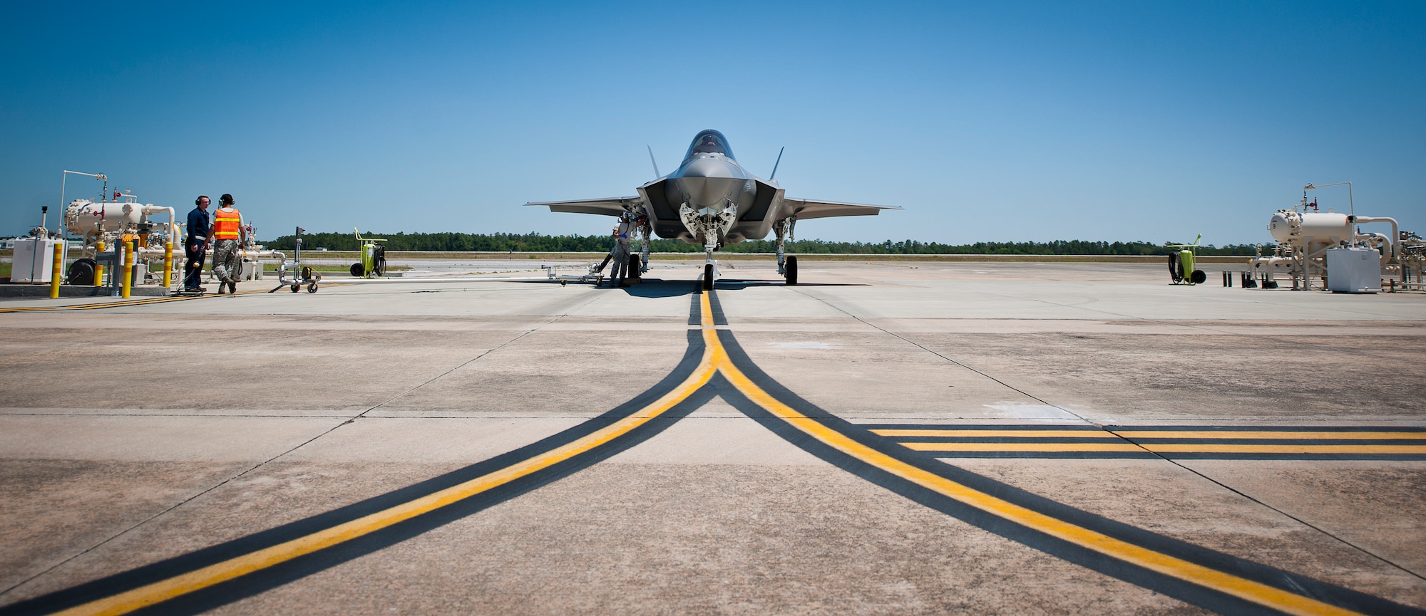 An F-35A Lightning II receives fuel from an extended arm attached to a hot pit station on the 33rd Fighter Wing flightline May 6 at Eglin Air Force Base, Fla.  The fuels flight facilitates the four hot pit stations on the 33rd FW flightline used by Air Force, Marine Corps and Navy F-35 aircraft. (U.S. Air Force photo/Samuel King Jr.)  