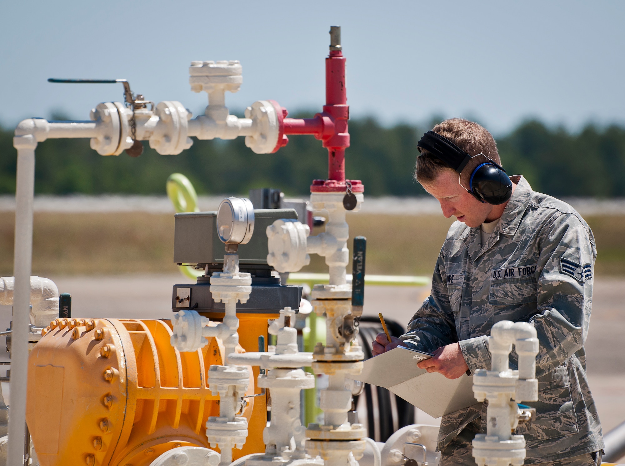 Senior Airman Jordan Shope, 96th Fuels Flight, marks down how much fuel was taken on after an F-35A Lightning II hot pit session May 6 at Eglin Air Force Base, Fla.  The fuels flight facilitates the four hot pit stations on the 33rd Fighter Wing flightline used by Air Force, Marine Corps, Navy and international-partner F-35 aircraft. (U.S. Air Force photo/Samuel King Jr.)  