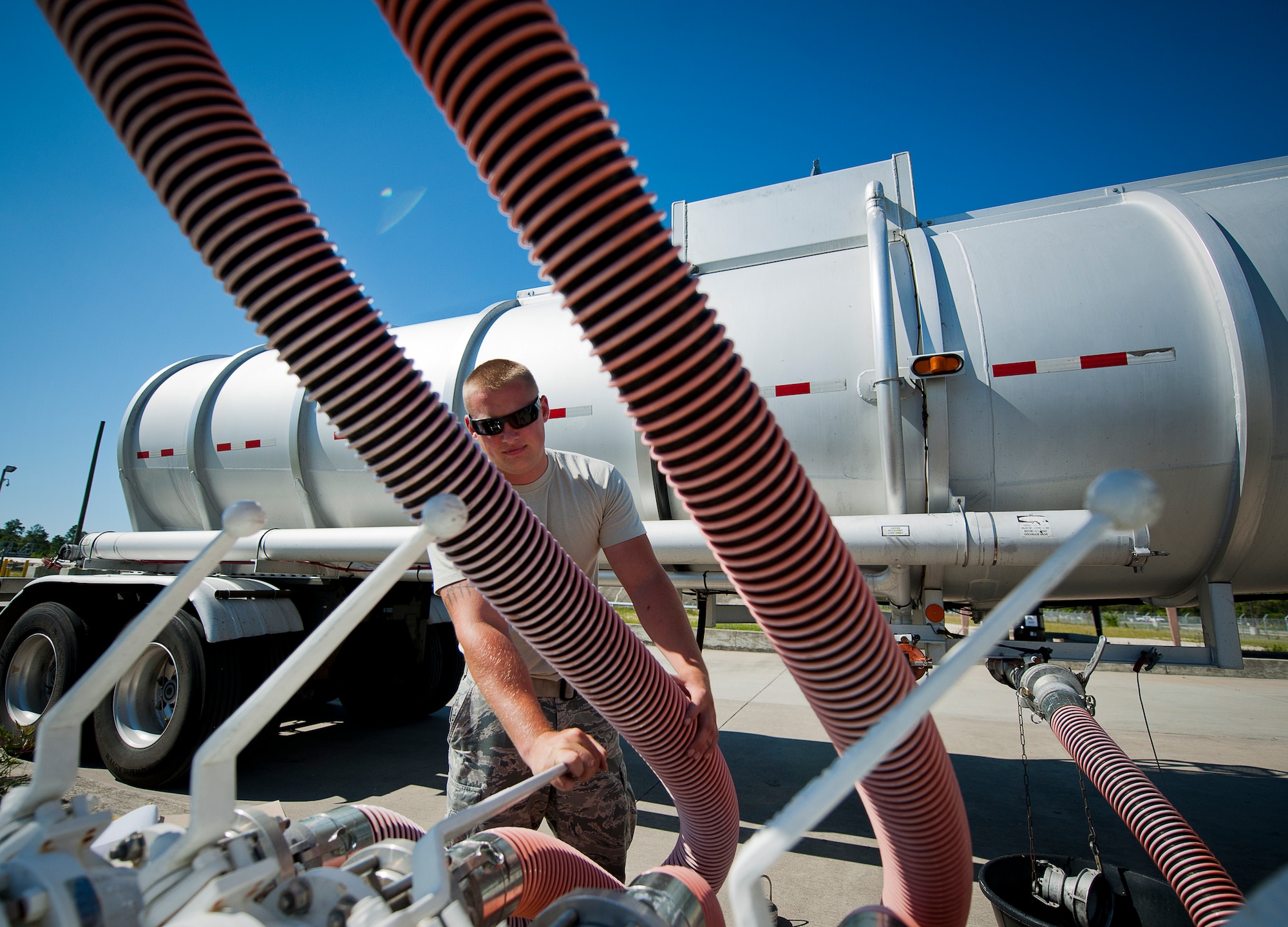 Staff Sgt. Corey Kleindienst, the 96th Fuels Flight, activates the fuel pump to receive the Jet-A fuel from the trucks May 6 at Eglin Air Force Base, Fla.  The fuel is stored in the 1.1 million gallon tanks on the 33rd Fighter Wing side of the base.  (U.S. Air Force photo/Samuel King Jr.)