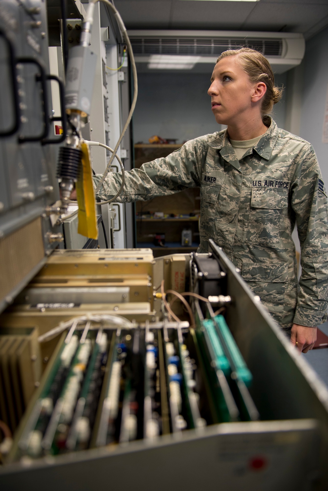 U.S. Air Force Senior Airman Taylor Anliker, a 52nd Communications Squadron Airfield Systems technician from Columbia, Mo., operates the Tactical Air Navigation system at Spangdahlem Air Base, Germany, May 16, 2014. The TACAN is the primary navigation aid for pilots arriving to and departing from Spangdahlem, letting aircrew pinpoint their location in relation to the base. (U.S. Air Force photo by Staff Sgt. Chad Warren/Released)