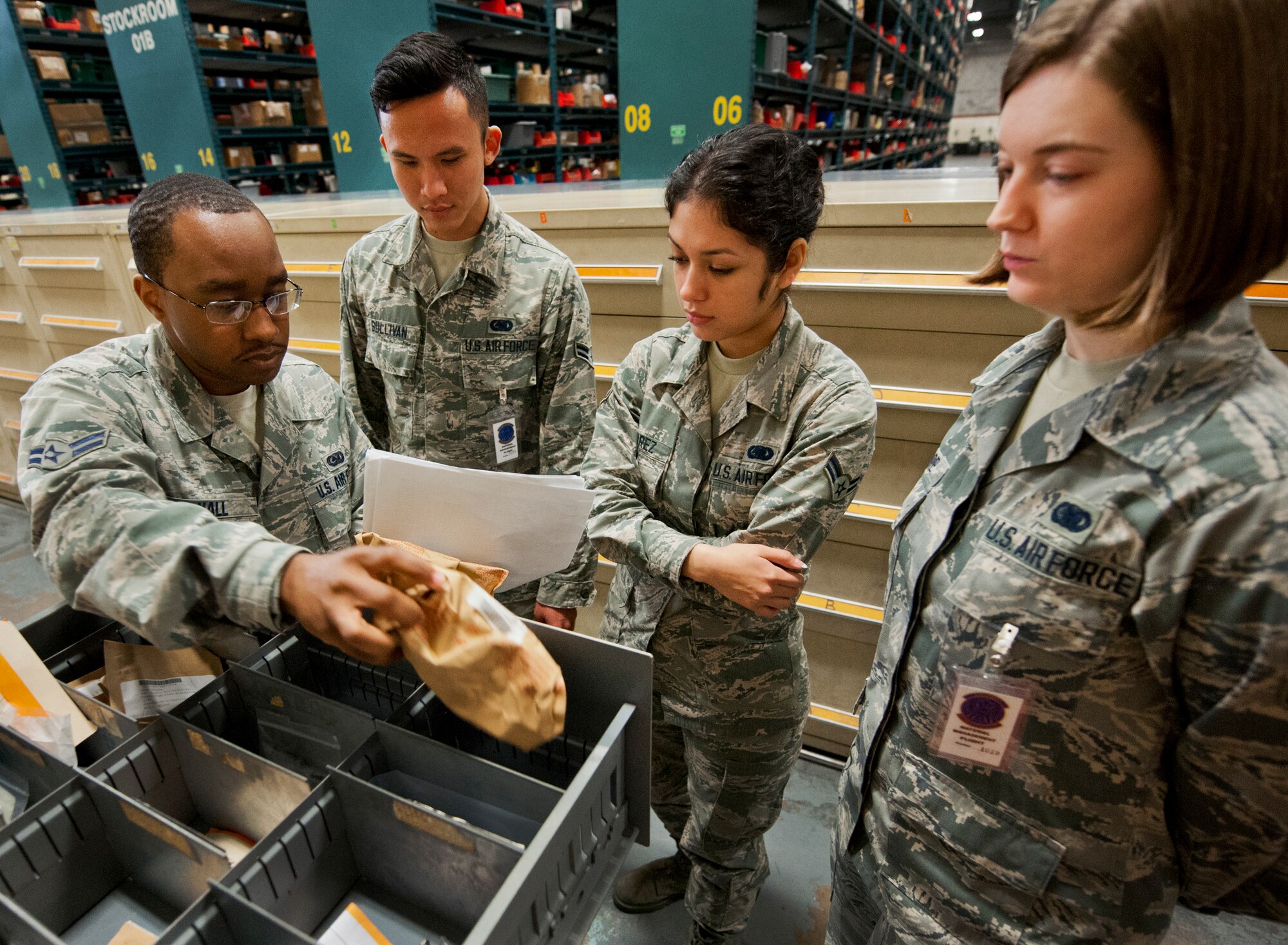 Airman 1st Class Andre Hall, 96th Logistics Readiness Squadron, explains inventory procedures to newly enlisted members of the 325th Logistics Readiness Squadron, at the supply warehouse May 15 on Eglin Air Force Base, Fla.  There are 13 LRS Airmen from Tyndall AFB receiving hands-on skills training from the materiel management flight’s “Supply University.”  After their month-long training, they’ll transition to a newly formed supply unit back at Tyndall.  (U.S. Air Force photo/Samuel King Jr.)