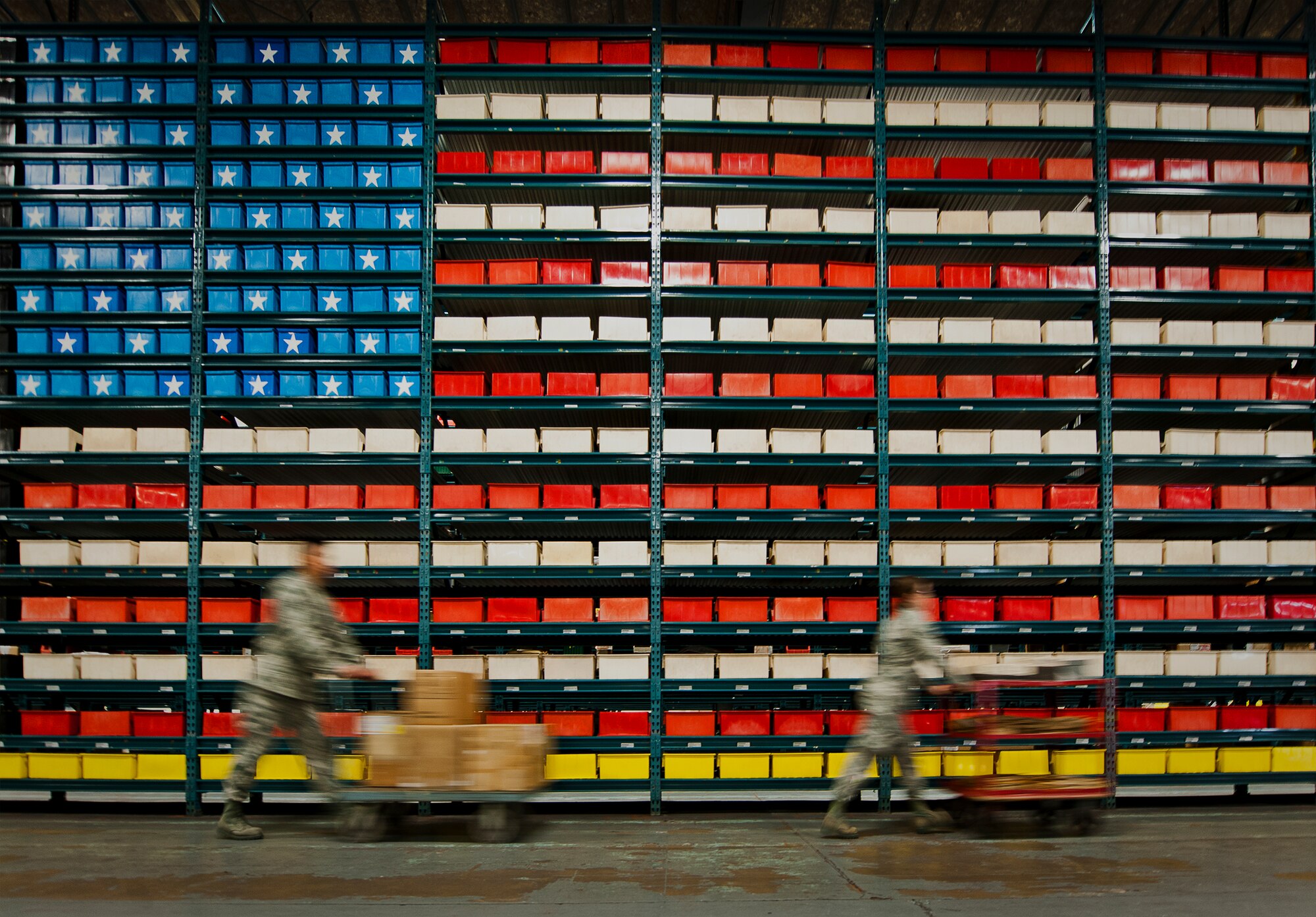 Airmen 1st Class Yenliang Lin and Andrea Dalton of the 325th Logistics Readiness Squadron, move supplies within the 96th Logistics Readiness Squadron’s supply warehouse May 15 on Eglin Air Force Base, Fla.  Lin and Dalton are two of 13 LRS Airmen from Tyndall AFB to receive hands-on skills training from the materiel management flight’s “Supply University.”  After their month-long training, they’ll transition to a newly formed supply unit back at Tyndall.  (U.S. Air Force photo/Samuel King Jr.)