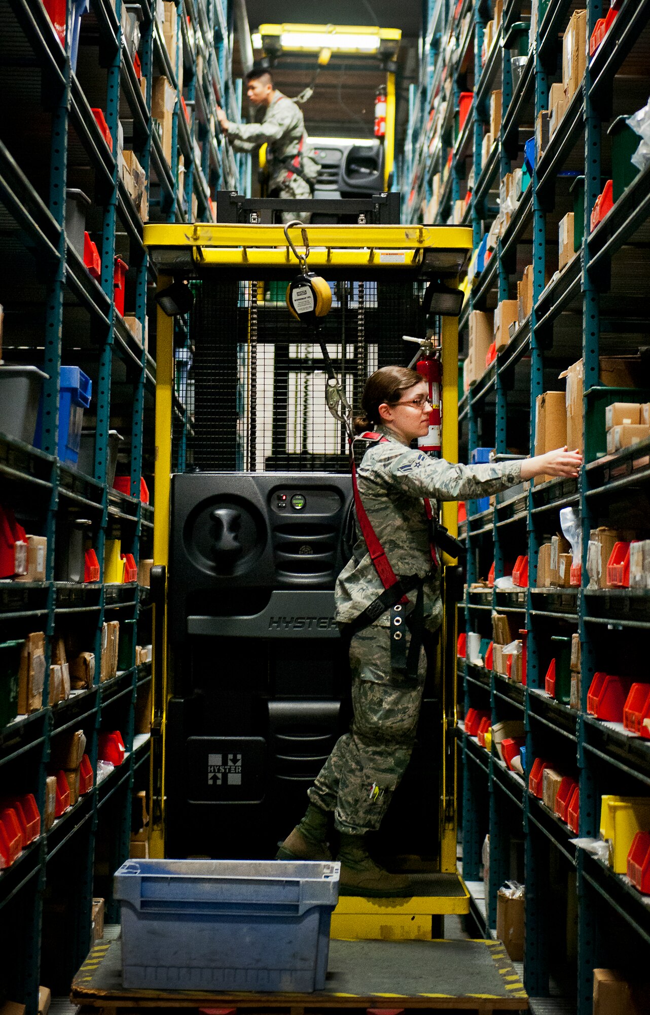 Airmen 1st Class Andrea Dalton and Yenliang Lin, of the 325th Logistics Readiness Squadron, train on the Hyster lifter at the 96th Logistics Readiness Squadron’s supply warehouse May 15 on Eglin Air Force Base, Fla.  Dalton and Lin are two of 13 LRS Airmen from Tyndall AFB to receive hands-on skills training from the materiel management flight’s “Supply University.”  After their month-long training, they’ll transition to a newly formed supply unit back at Tyndall.  (U.S. Air Force photo/Samuel King Jr.)