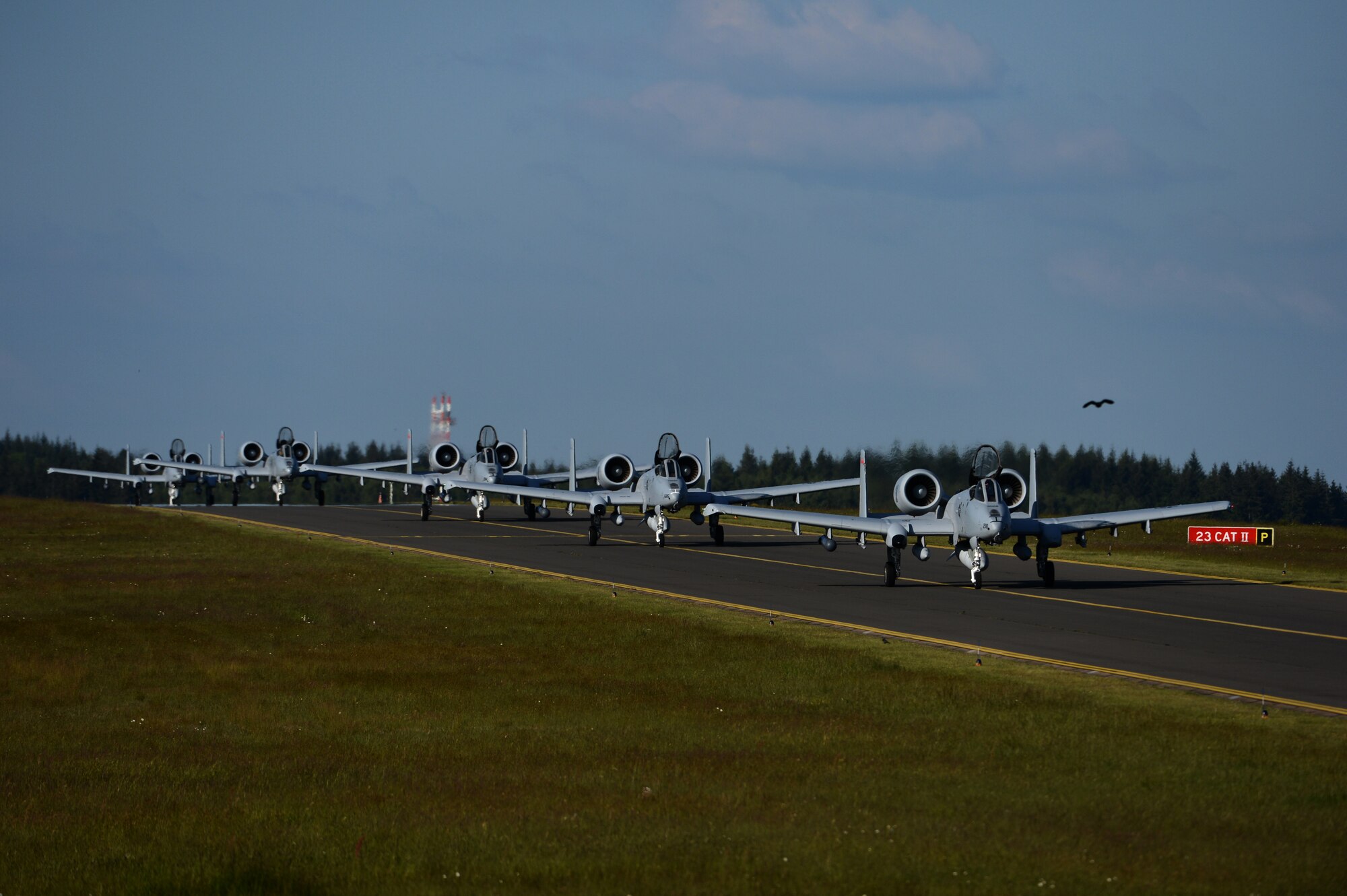 Five U.S. Air Force A-10 Thunderbolt II attack aircraft pilots taxi on the flightline at Spangdahlem Air Base, Germany, May 16, 2014. While in Germany, the aircraft will support the ground troops of 15 nations participating in force-on-force maneuver training during Exercise Combined Resolve II. (U.S. Air Force photo by Senior Airman Gustavo Castillo/Released)