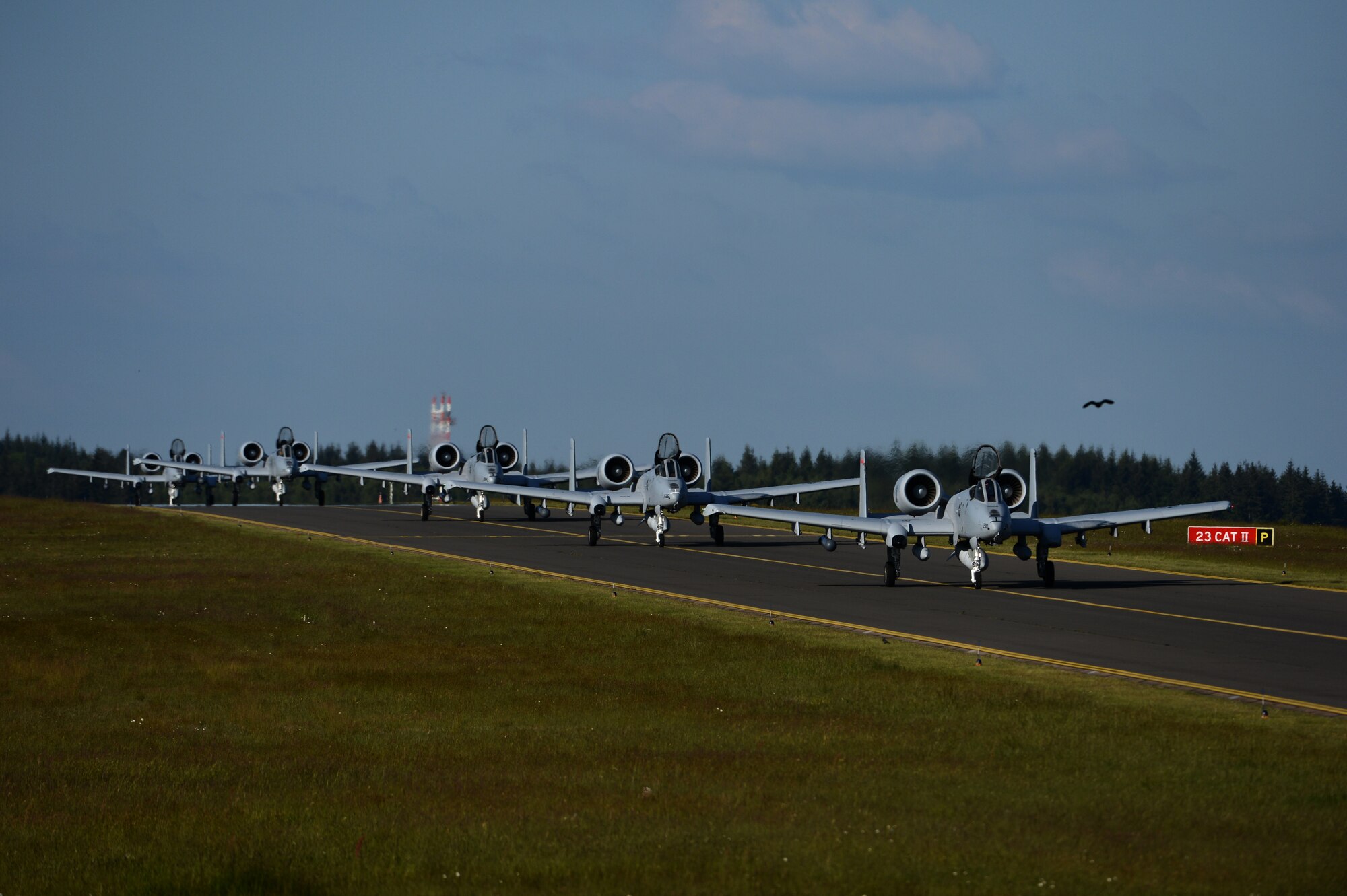 Five U.S. Air Force A-10 Thunderbolt II attack aircraft pilots taxi on the flightline at Spangdahlem Air Base, Germany, May 16, 2014. While in Germany, the aircraft will support the ground troops of 15 nations participating in force-on-force maneuver training during Exercise Combined Resolve II. (U.S. Air Force photo by Senior Airman Gustavo Castillo/Released)