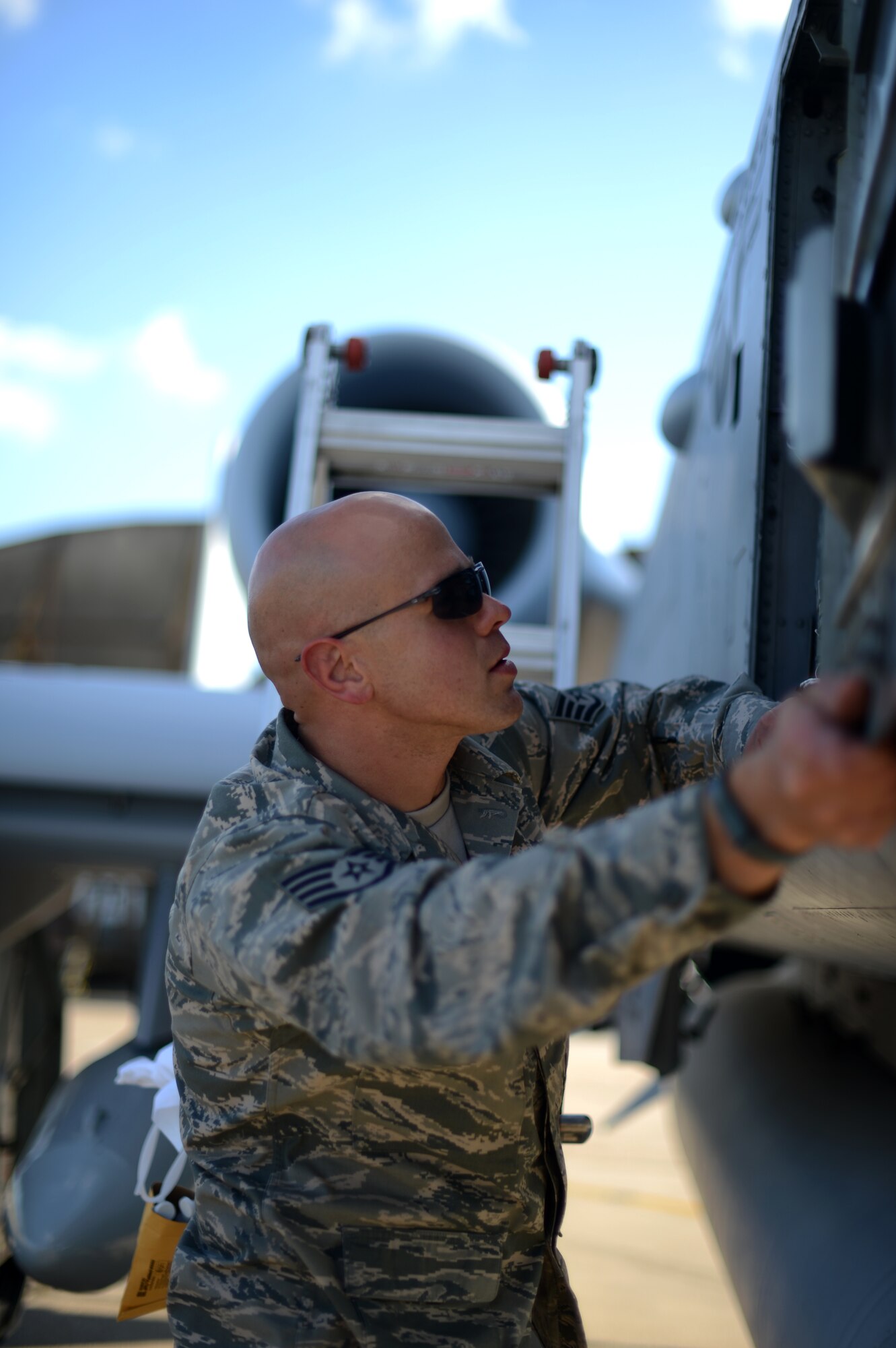 U.S. Air Force Staff Sgt. William McBride, 124th Aircraft Maintenance Squadron crew chief from Boise, Idaho, inspects a panel of a U.S. Air Force A-10 Thunderbolt II attack aircraft on the flightline at Spangdahlem Air Base, Germany, May 16, 2014. Airmen complete post-flight checks to ensure aircraft are safe and ready to fly for their next mission. The aircraft and personnel flew to Germany to support NATO allies in Exercise Combined Resolve II. (U.S. Air Force photo by Senior Airman Gustavo Castillo/Released) 