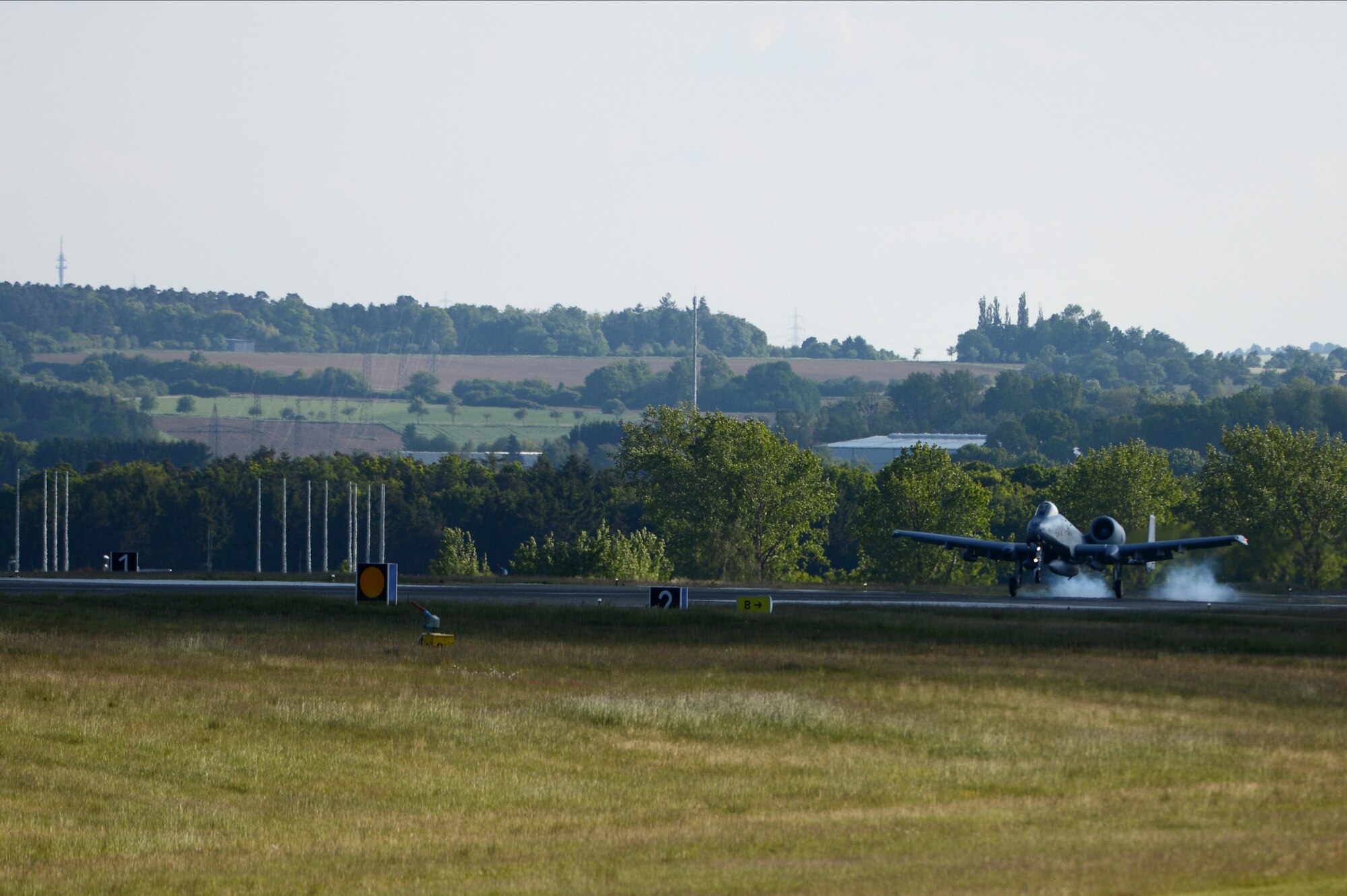 A U.S. Air Force A-10 Thunderbolt II attack aircraft pilot from the 190th Fighter Squadron lands on the flightline at Spangdahlem Air Base, Germany, May 16, 2014. Approximately 100 Air National Guard Airmen from Gowen Field, Idaho, accompanied the aircraft in support of exercise Combined Resolve II. The exercise uses the air power provided by the A-10s to assist ground forces from NATO allies with close-air-support procedures and operations. (U.S. Air Force photo by Senior Airman Gustavo Castillo/Released) 