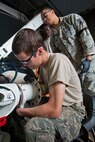 Airman 1st Class Gerald R. Meagher, front, places a brake collar on a KC-135R Stratotanker wing landing gear axle as Tech. Sgt. Mike R. Baber, back right, and Tech. Sgt. Tyrice J. Pressley, observe May 18, 2014, at Joint Base McGuire-Dix-Lakehurst, N.J. All three Airmen are with the 108th Wing Maintenance Squadron, New Jersey Air National Guard. (U.S. Air National Guard photo by Master Sgt. Mark C. Olsen/Released)