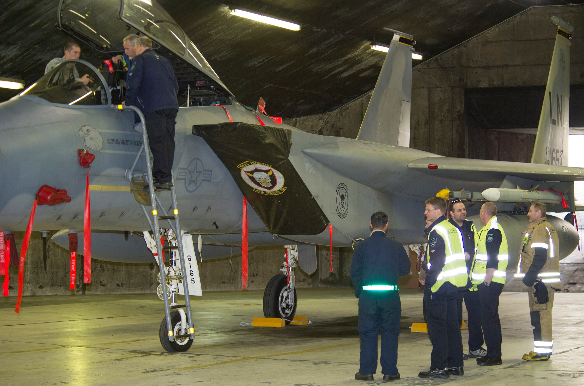 KEFLAVIK, Iceland -- Airfield service members learn pilot extraction techniques for the F-15C Eagle at Keflavik International Airport, May 16, 2014. Airfield services were trained so they could help respond in the event of an emergency while the aircraft is deployed for Icelandic Air Policing. (U.S. Air Force photo/Tech. Sgt. Benjamin Wilson)(Released)