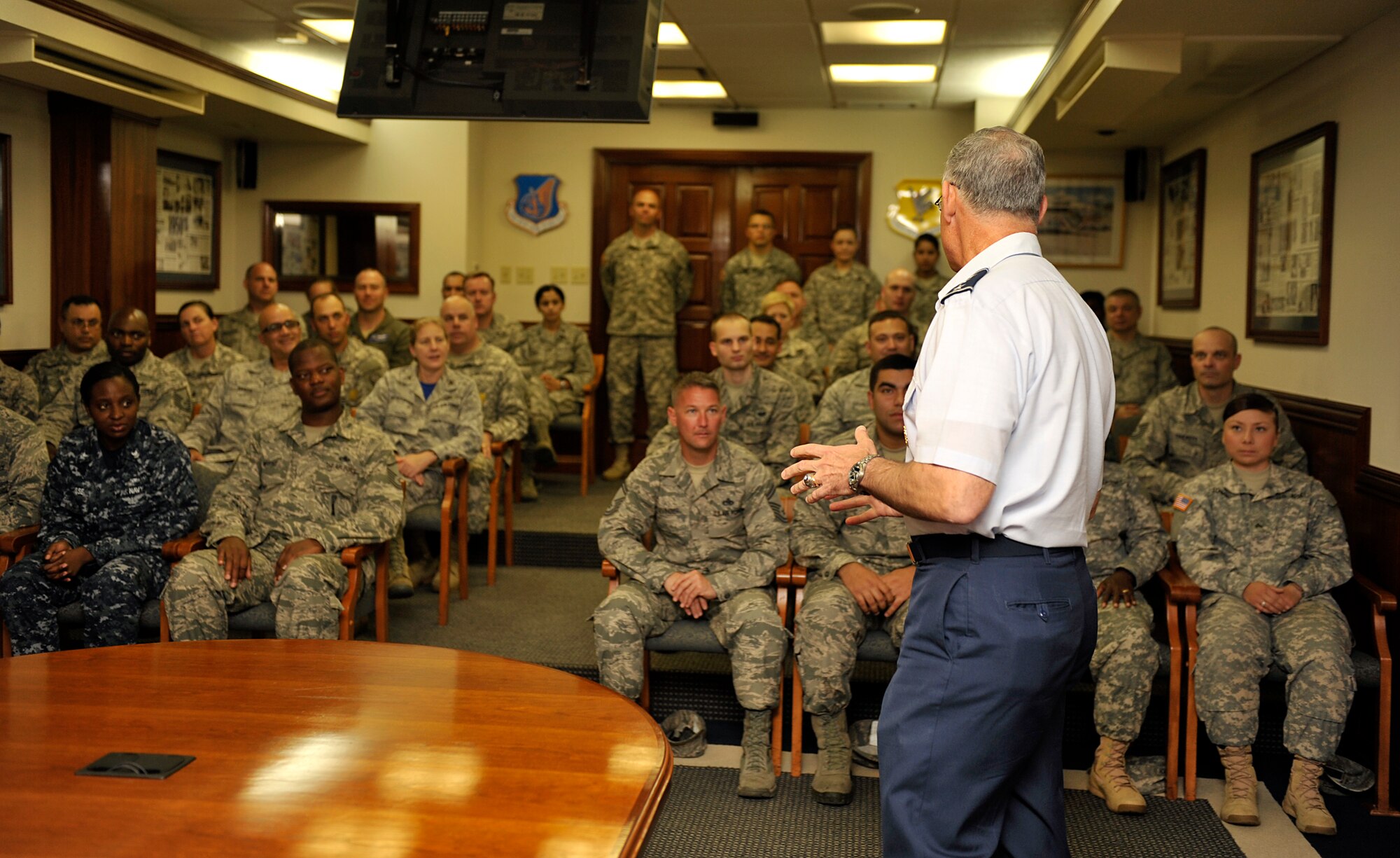 U.S. Air Force Lt. Gen. Salvatore Angelella, U.S. Forces Japan and 5th Air Force commander, recognizes 12 service members for their achievements during a coin presentation on Kadena Air Base, Japan, May 16, 2014. During Angelella's visit to Okinawa, he presented coins to 12 service members for their excellent performance and achievements. (U.S. Air Force photo by Naoto Anazawa)