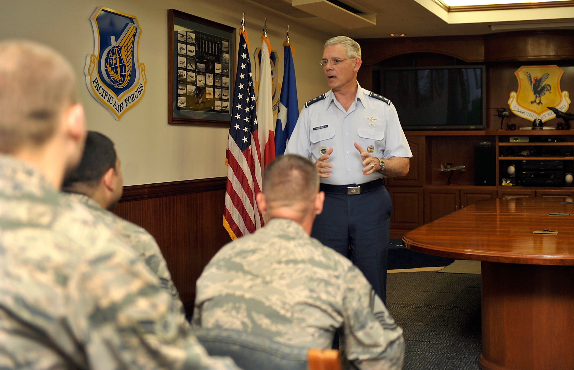 U.S. Air Force Lt. Gen. Salvatore Angelella, U.S. Forces Japan and 5th Air Force commander, thanks Kadena's recent top performers during a coin presentation on Kadena Air Base, Japan, May 16, 2014. During Angelella's visit to Okinawa, he presented coins to 12 service members for their excellent performance and achievements. (U.S. Air Force photo by Naoto Anazawa)