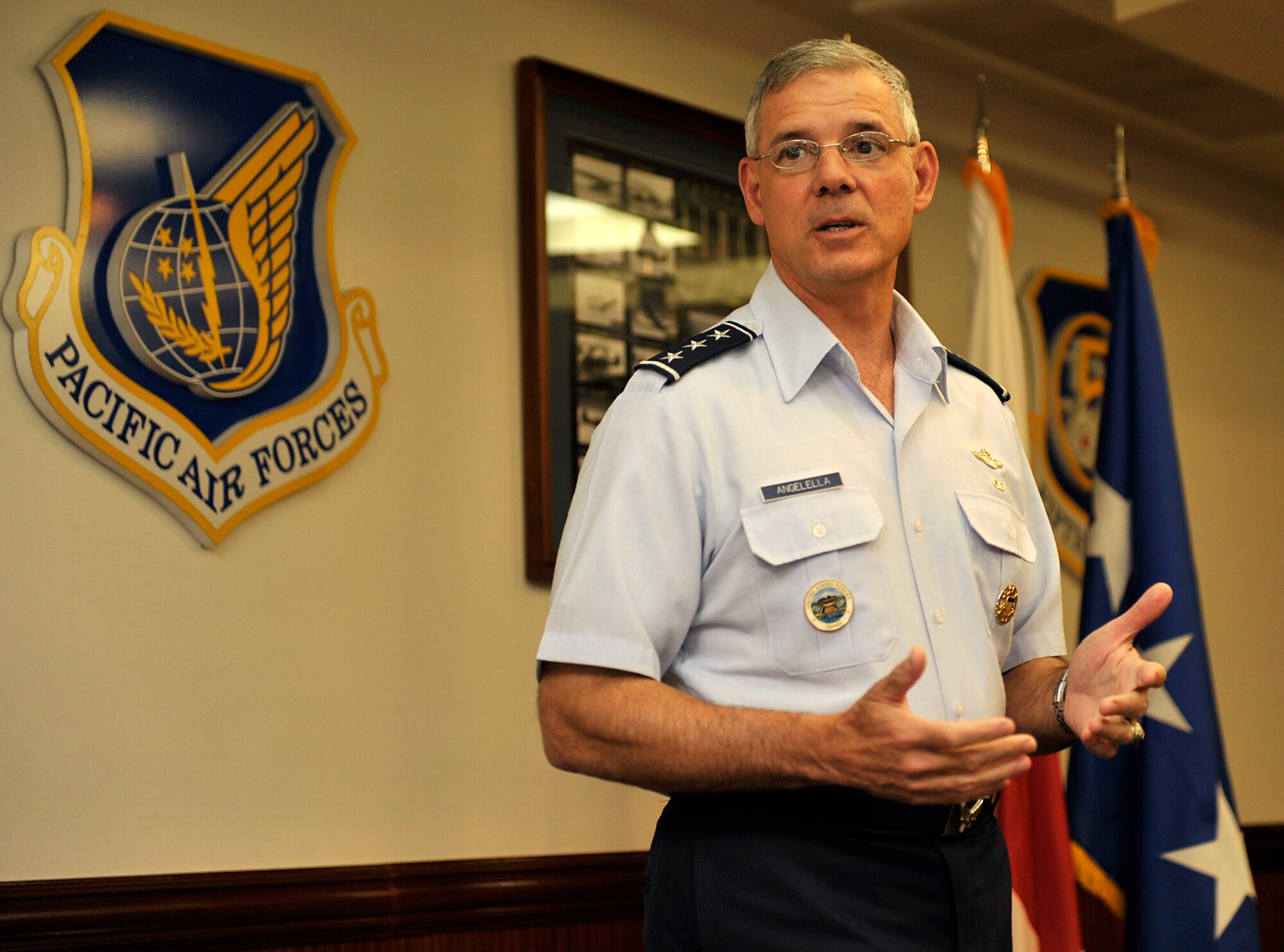 U.S. Air Force Lt. Gen. Salvatore Angelella, U.S. Forces Japan and 5th Air Force commander, thanks Kadena's recent top performers during a coin presentation on Kadena Air Base, Japan, May 16, 2014. There were 12 service members that received a coin from Angelella for their excellent performance and achievements. (U.S. Air Force photo by Naoto Anazawa)
