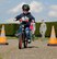 A military child navigates his bicycle through an obstacle course during a bike safety rodeo at RAF Alconbury, United Kingdom, May 14, 2014. The rodeo was held as a part of Police Week and focused on teaching children good bike safety habits. (U.S. Air Force photo by Staff Sgt. Jarad A. Denton/Released)