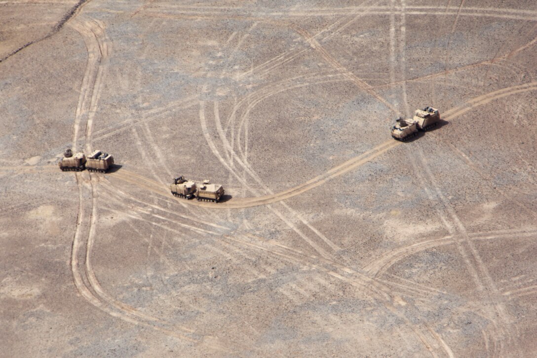 An aerial view from a UH-1Y Huey helicopter shows a ground convoy safely maneuvering along a route in support of retrograde operations in Helmand province, Afghanistan, May 3, 2014. The Marines and sailors of Forward Operating Bases Nolay and Sabit Qadam convoyed out of northern Helmand province and returned to Camp Leatherneck for the final time.