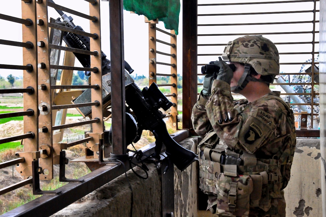 U.S. Army Sgt. Amanda Olmeda provides security from an observation tower on Forward Operating Base Fenty in Afghanistan's Nangarhar province, March 13, 2013. Olmeda, a chaplain's assistant, is assigned to the 101st Airborne Division's Headquarters Company, 1st Brigade Combat Team.  
