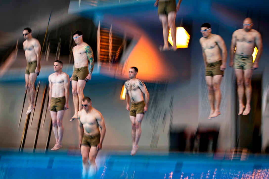 Marine students jump in the water during graduation practice for a water survival course on Marine Corps Base Camp Johnson, N.C., March 12, 2013. The course creates instructors who can train other Marines to react and survive life-threatening situations in the water.  
