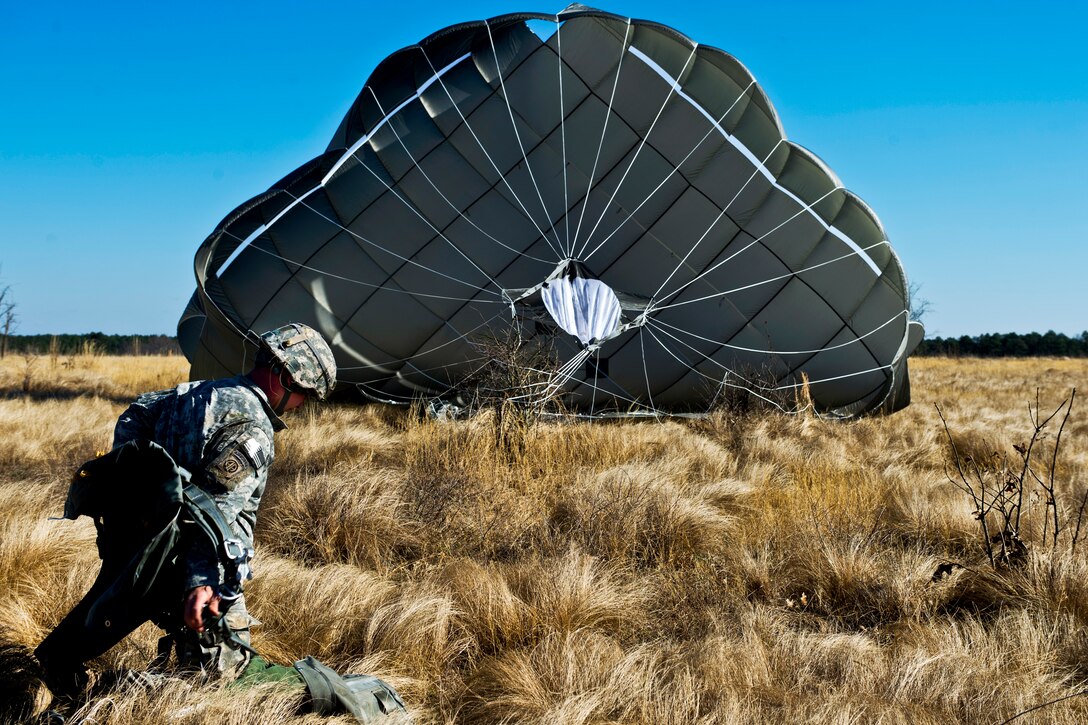 U.S. Army Staff Sgt. Andrew Williamson lands after a static line airdrop during Joint Operational Access Exercise 13-02 on Camp Mackall, N.C., Feb. 24, 2013. The exercise is designed to enhance service cohesiveness between Army and Air Force personnel, allowing both services an opportunity to properly execute heavy equipment and troop movement. Williamson is a squad leader assigned to the 82nd Airborne Division, Charlie Company, 1st Brigade Combat Team.  

